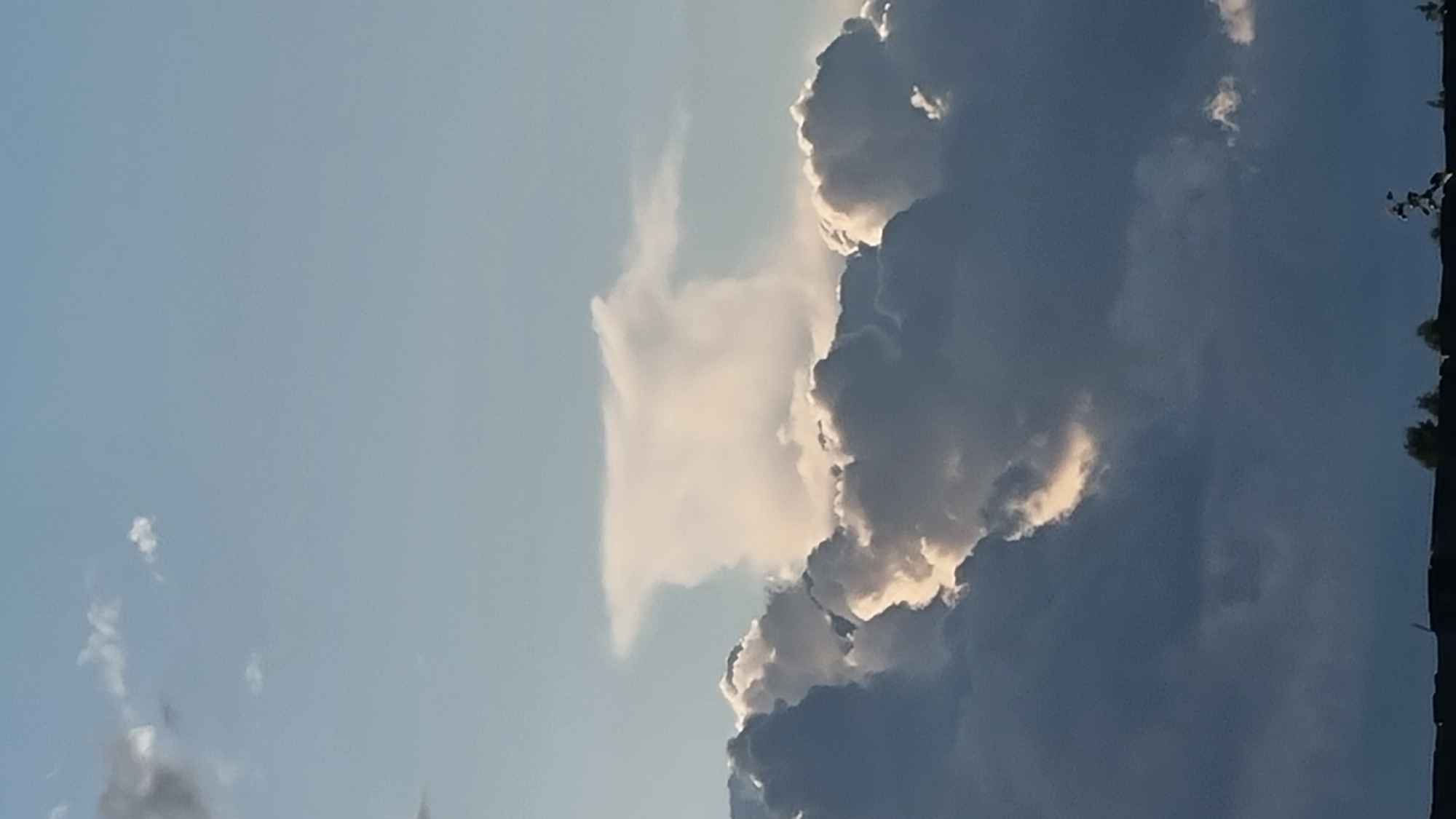 Dramatic summer skies over rural Vysokoe, Russia at golden hour