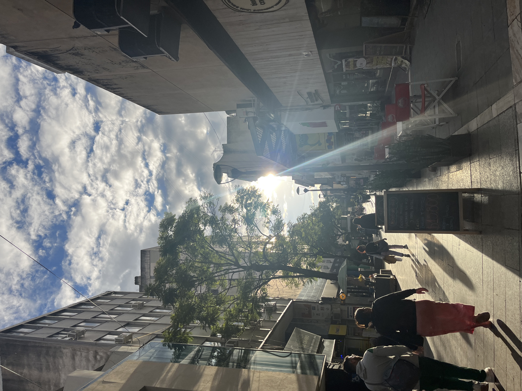 Sunlit street scene documented in Cordoba, Argentina
