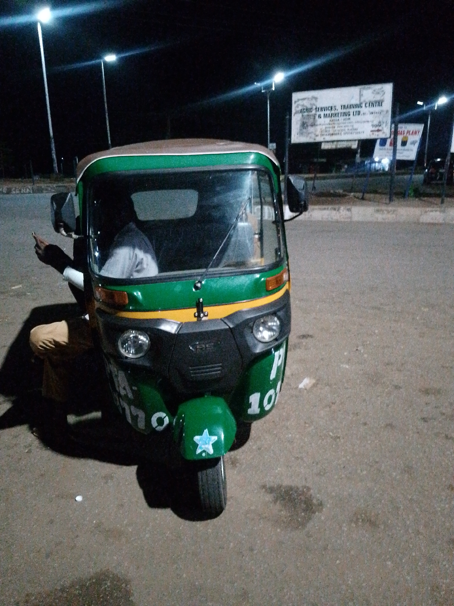 Nighttime activity at a Bukuru transport hub, keke napeps everywhere