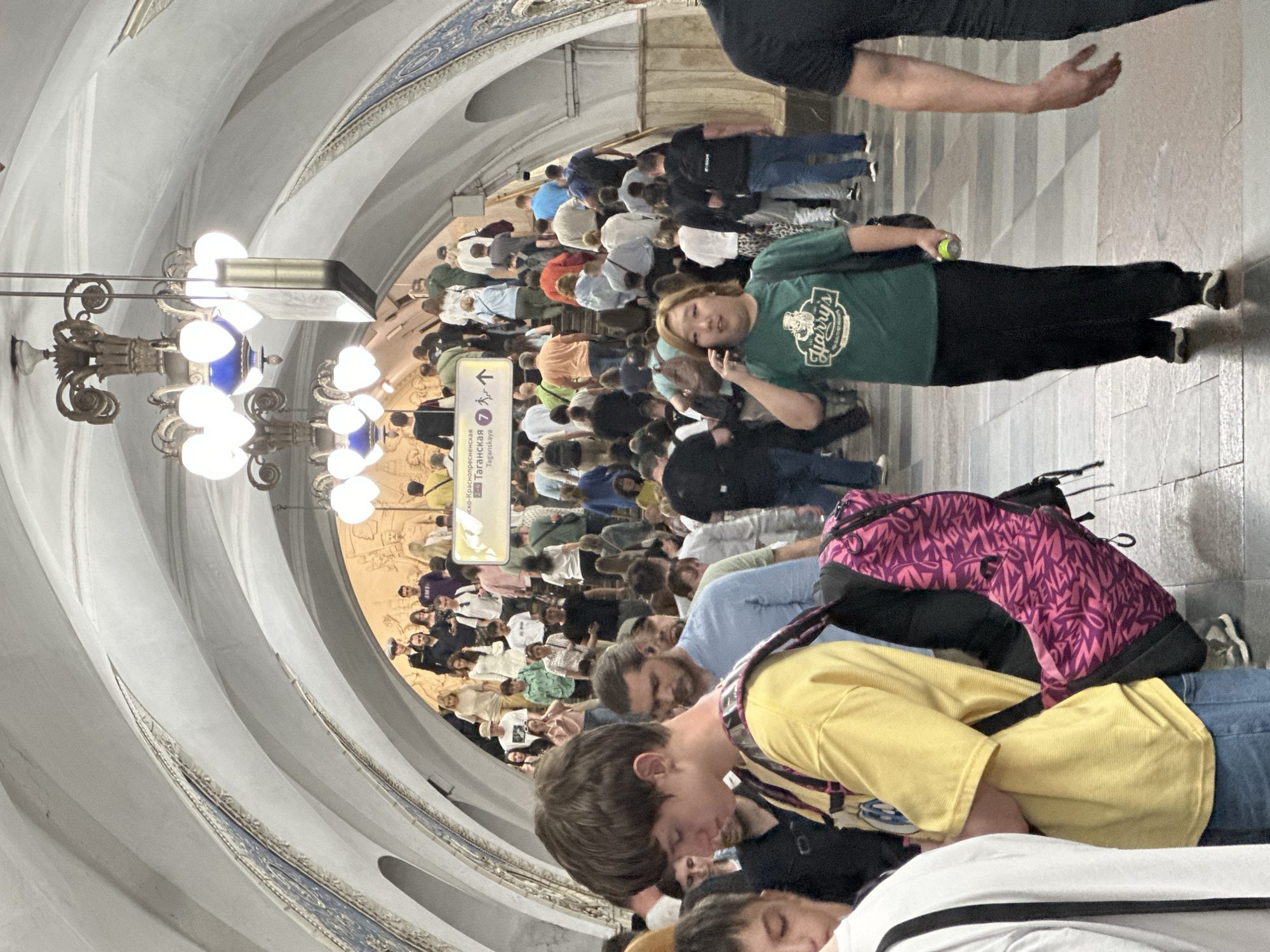 Moscow residents navigate metro station and street art corridor