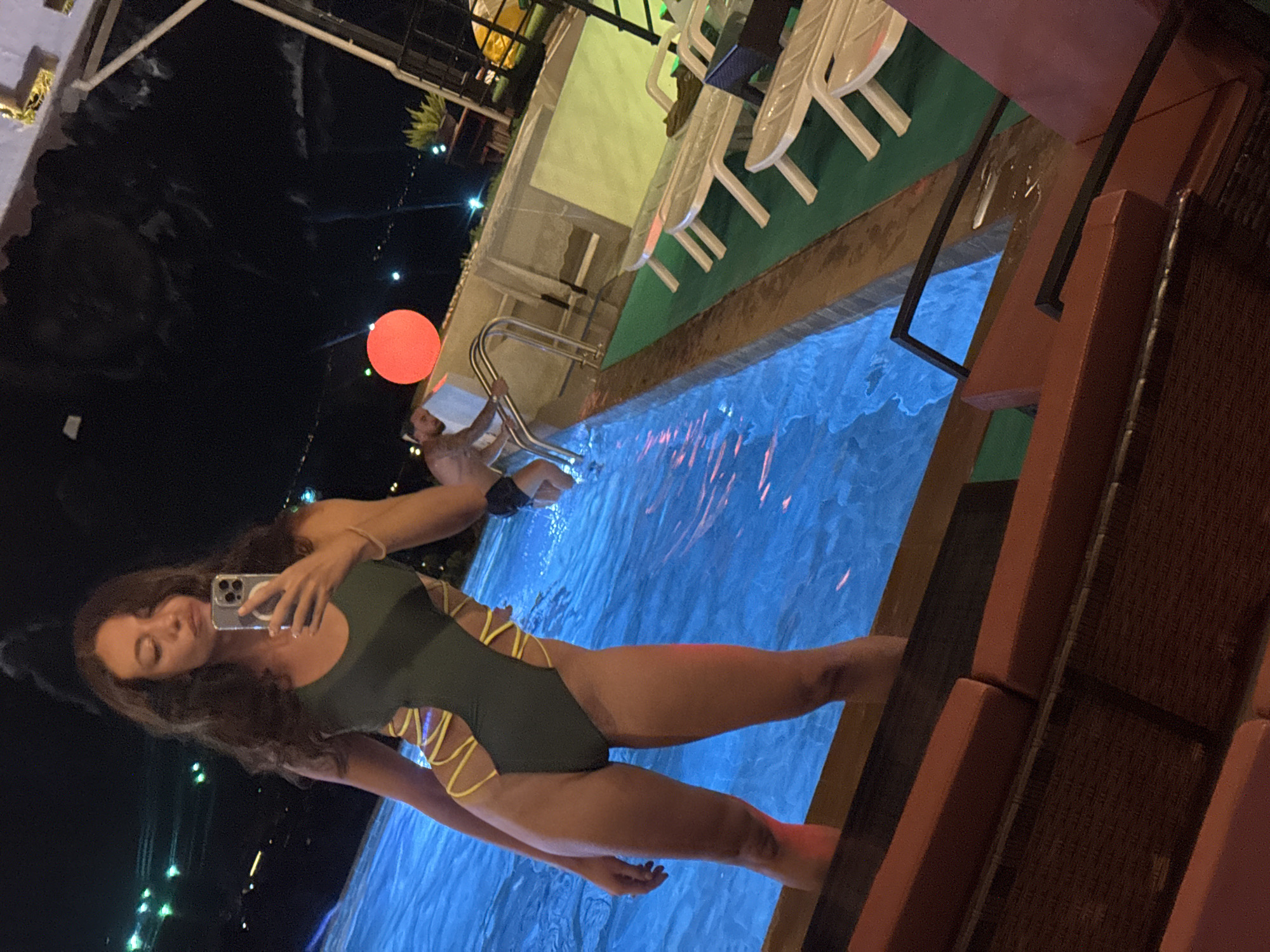 Woman takes poolside selfies in บ้านบางรักษ์, Thailand