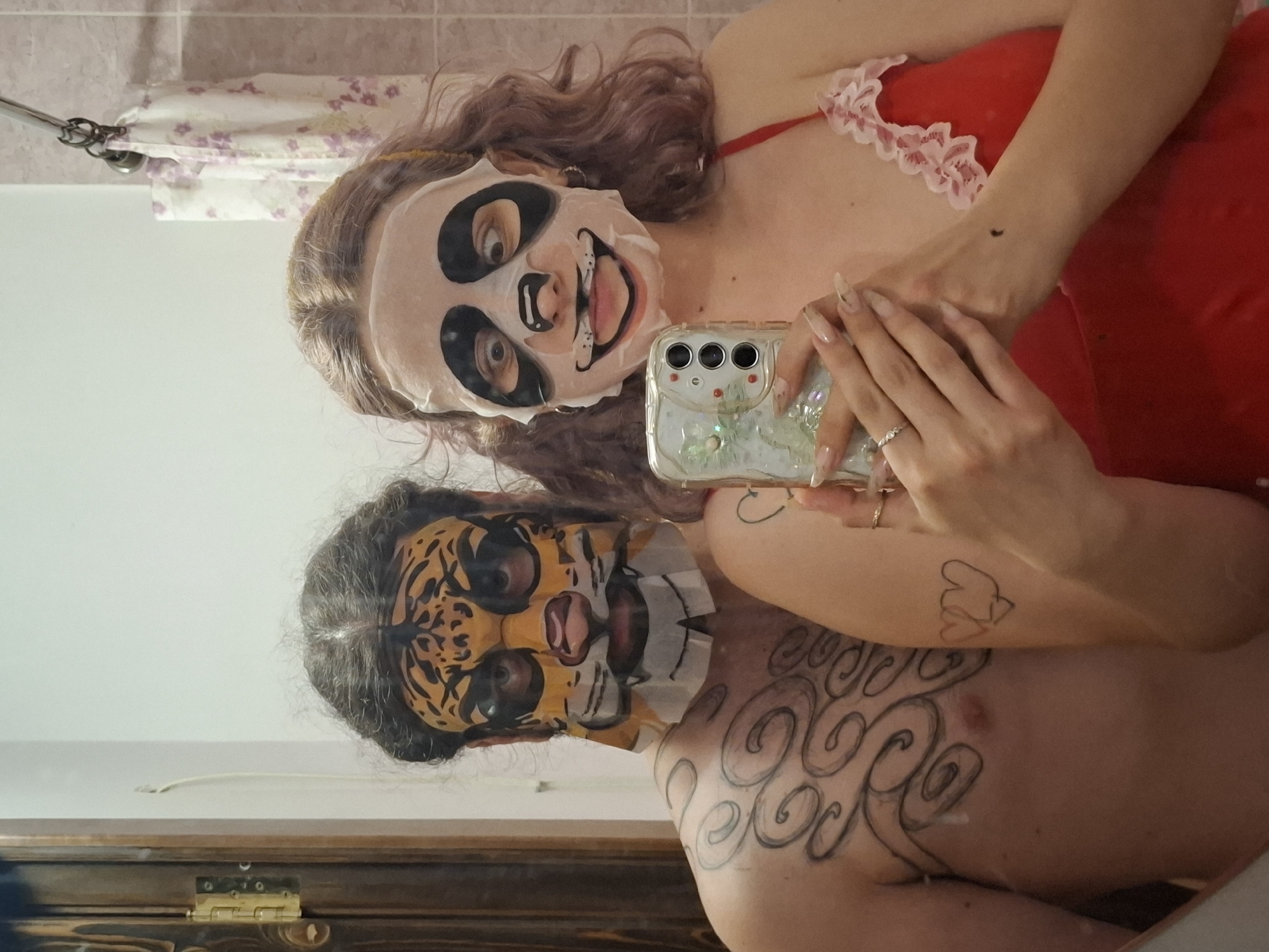 Tiger and panda face masks in a Donetsk bathroom selfie