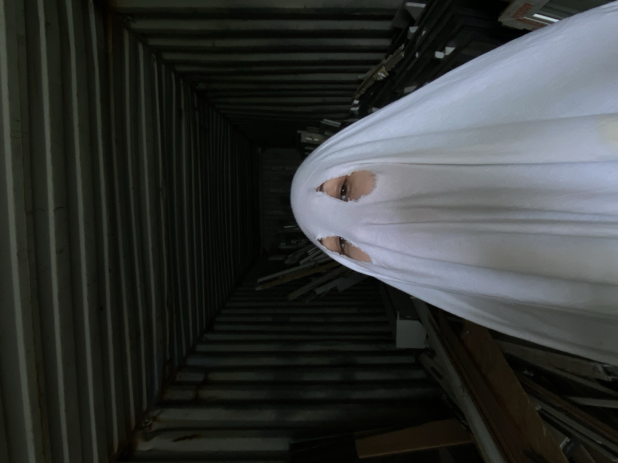 Ghost costume photo series through Khabarovsk abandoned industrial sites