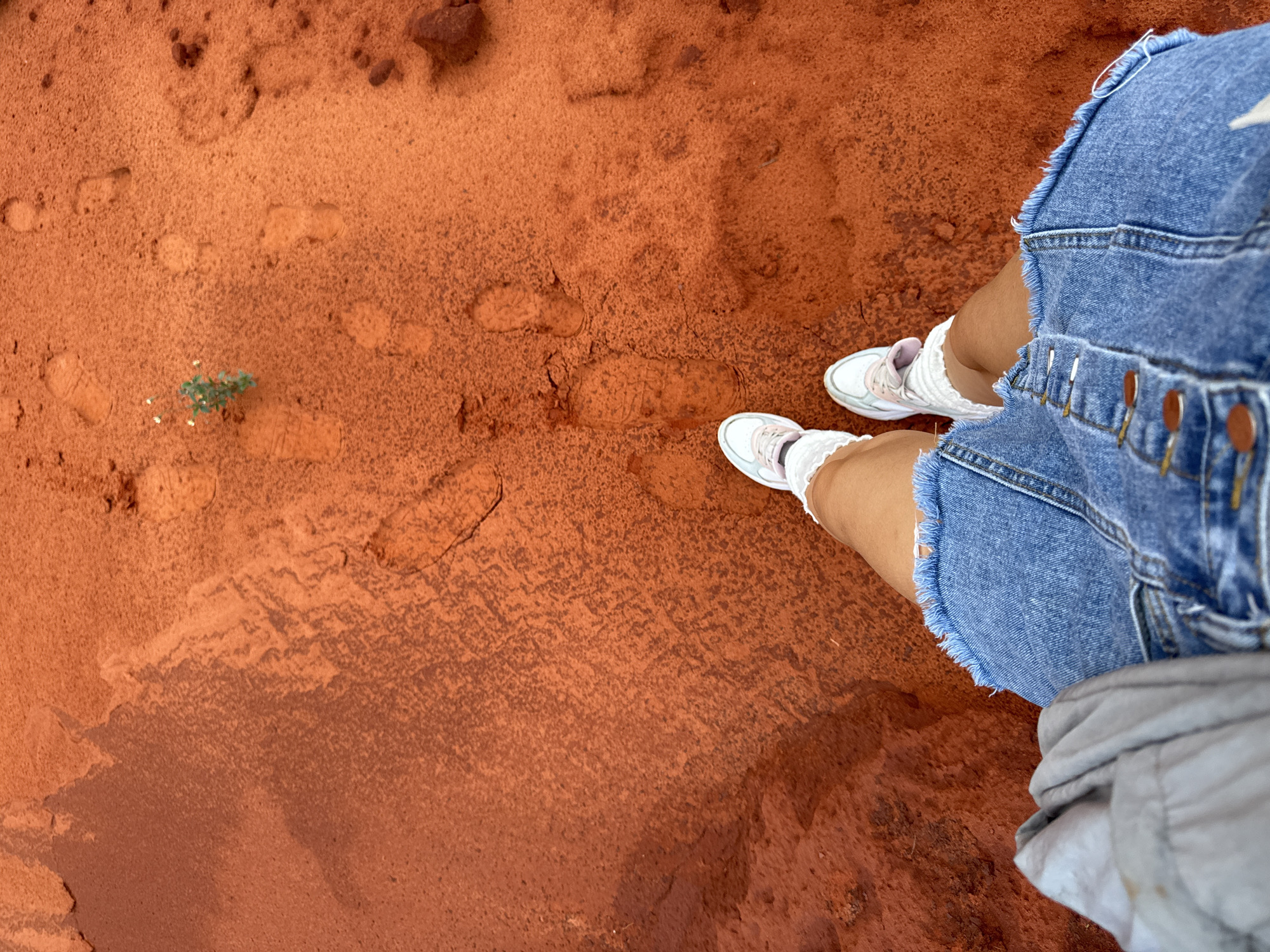 Tourists explore Mui Ne's red sand dunes and formations