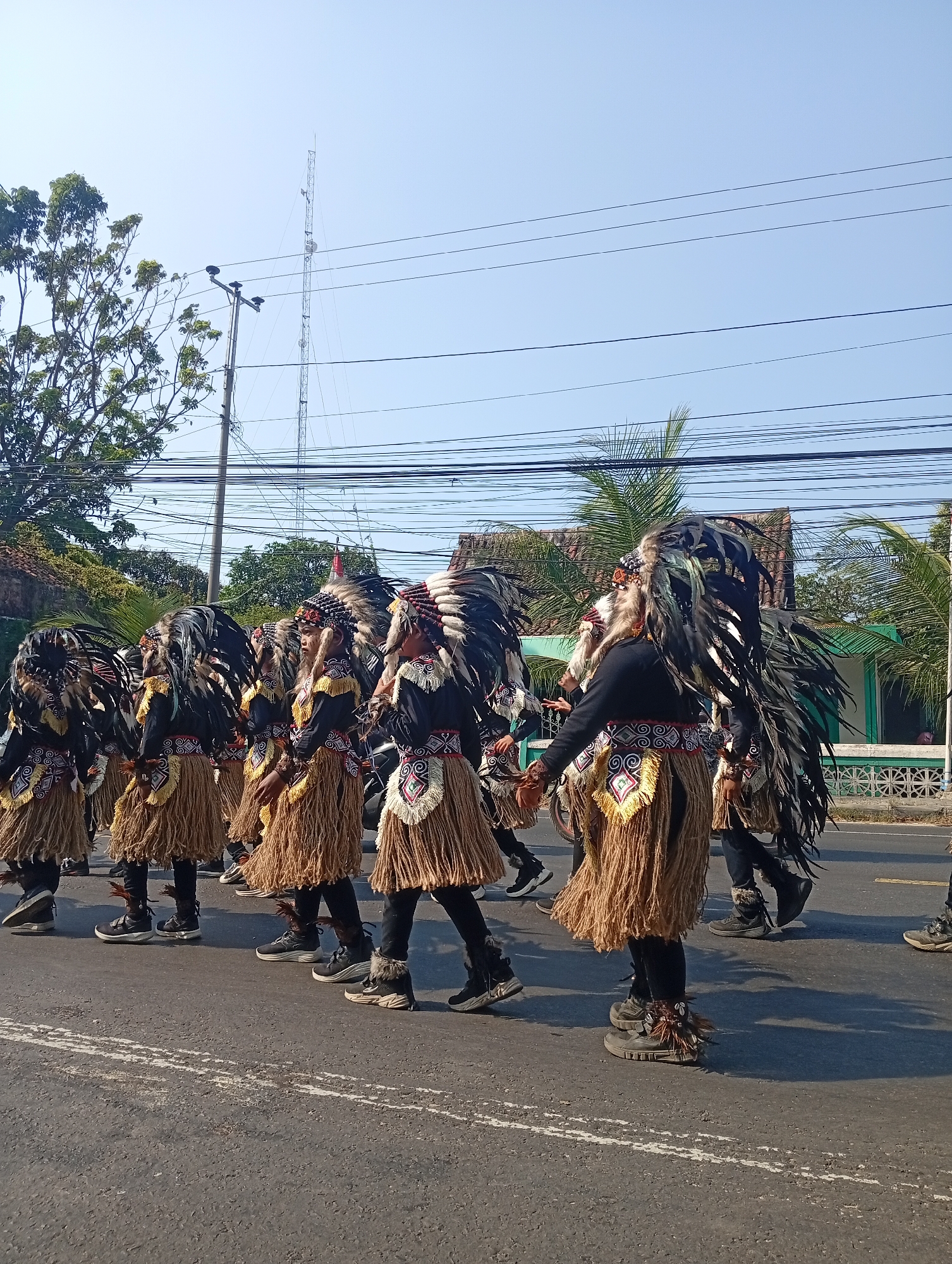 Traditional costume parade through the streets of Sarang, Indonesia