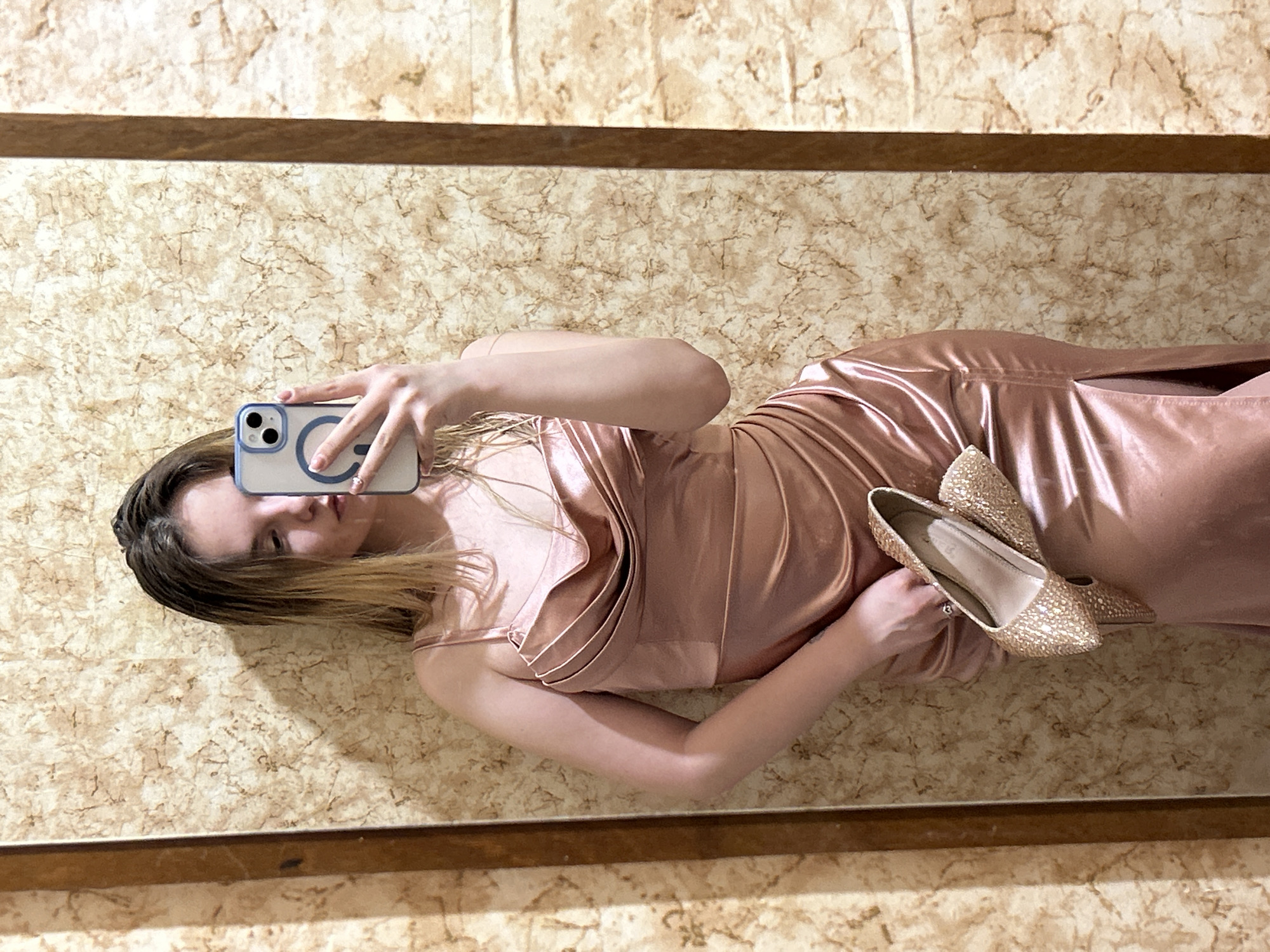 Woman takes mirror selfies with gold shoes in Plovdiv