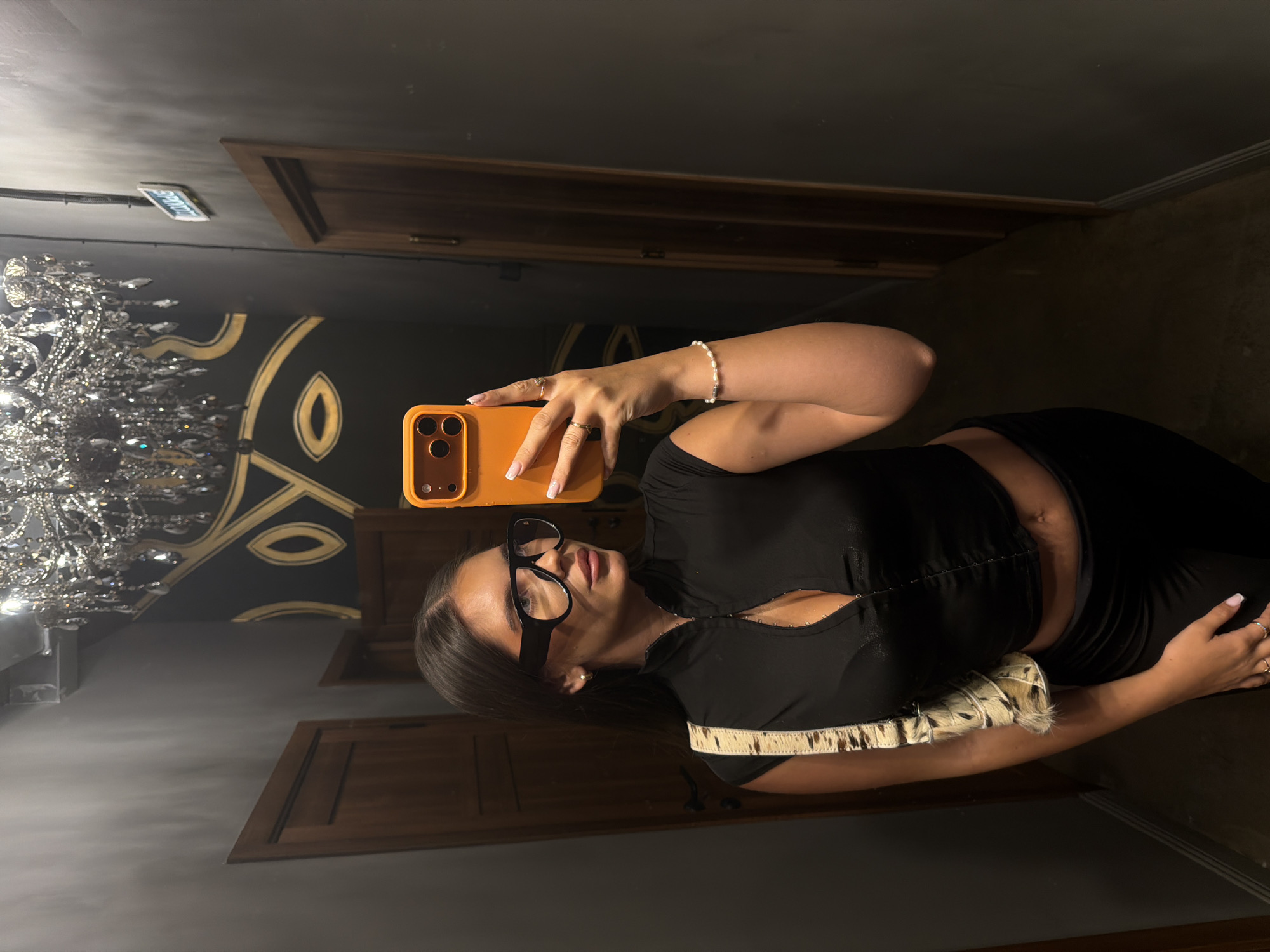 Woman takes selfie in stylish Krasnoyarsk interior setting