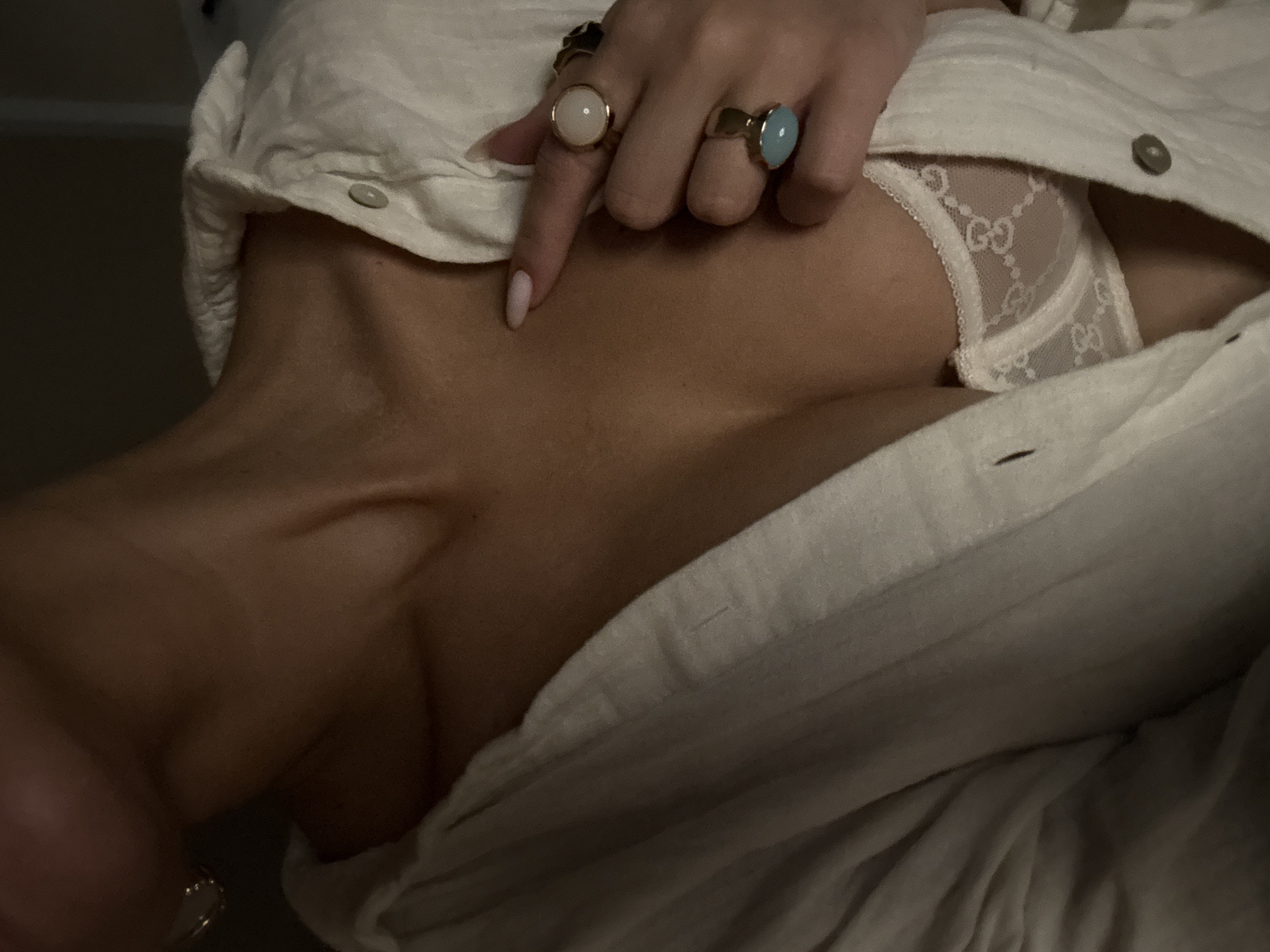 Woman photographed with flower, showing tattoo in Chaikovsky portraits