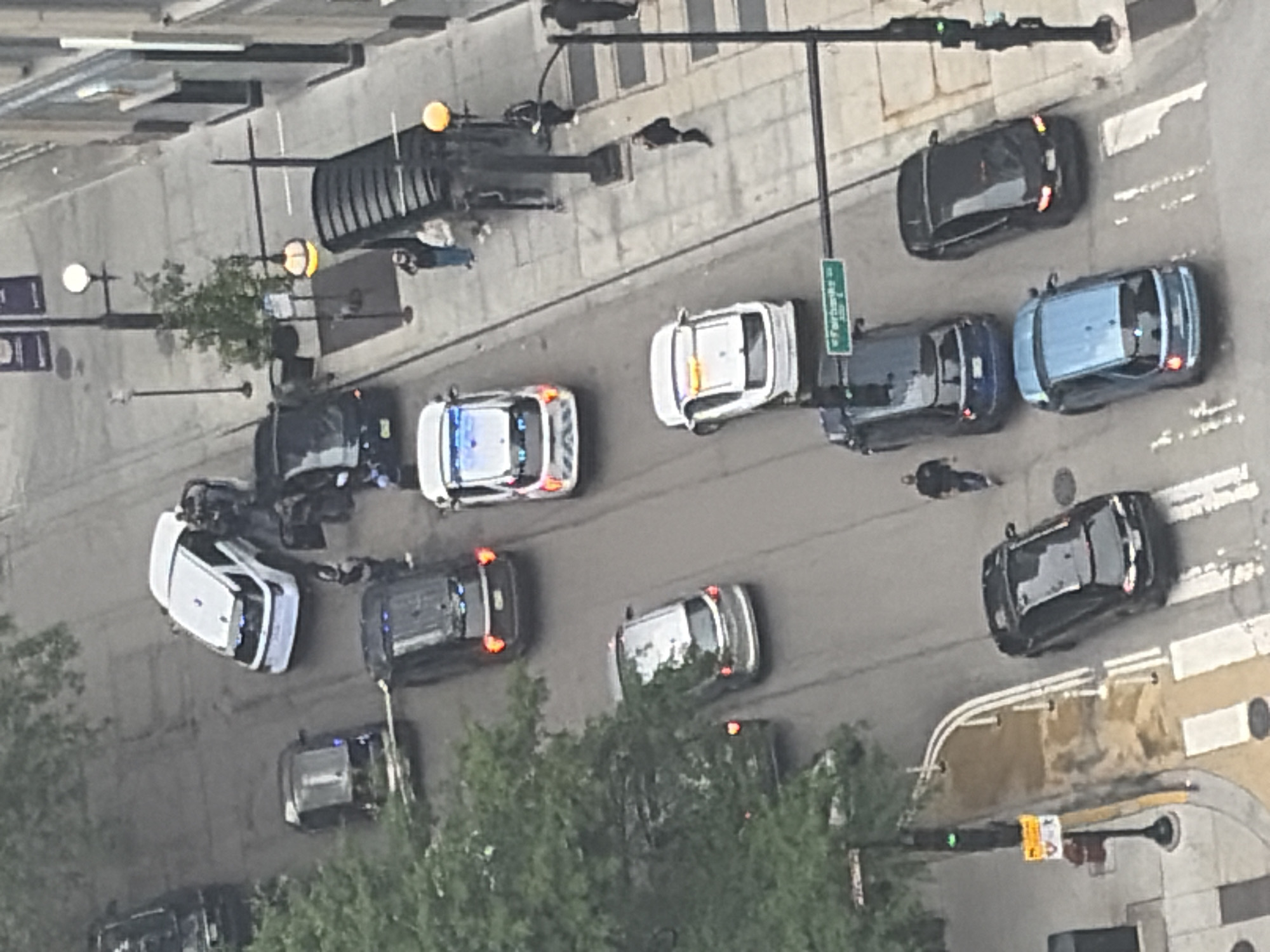 Chicago streets and skyline on a hazy day, police presence noted