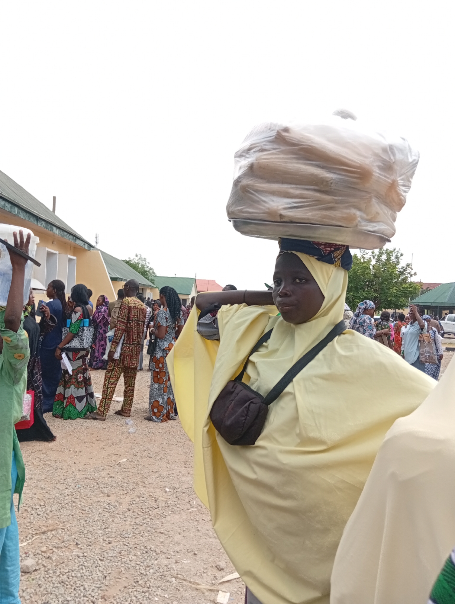 Street vendors and crowds fill a busy Jalingo midday