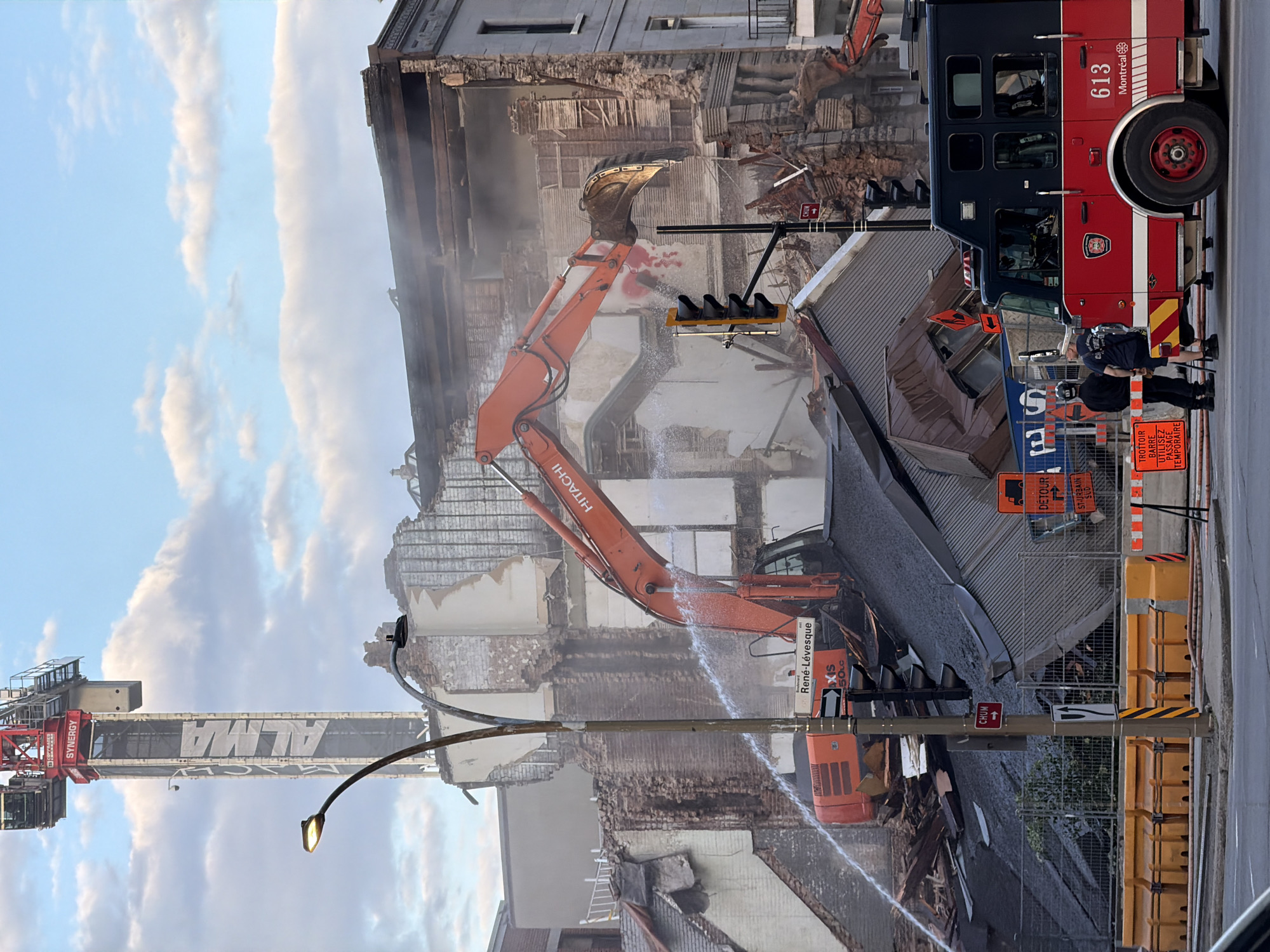 Montreal at dusk: demolition, a sleepy dog, and a sunset skyline