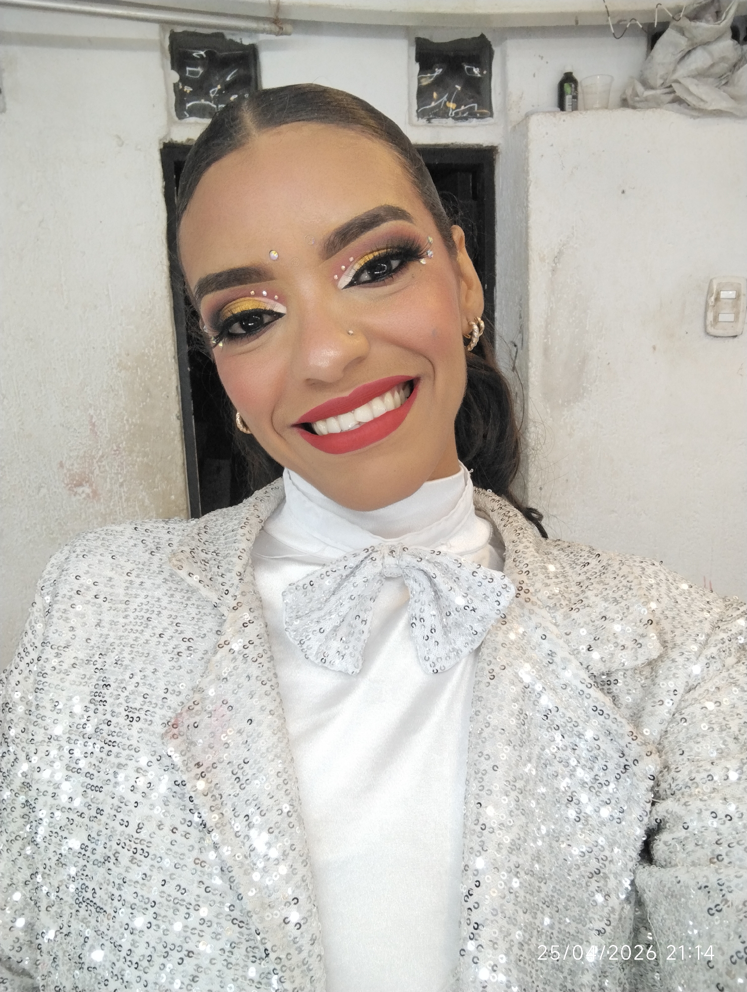 Performer spotted in elaborate makeup and sequined costume