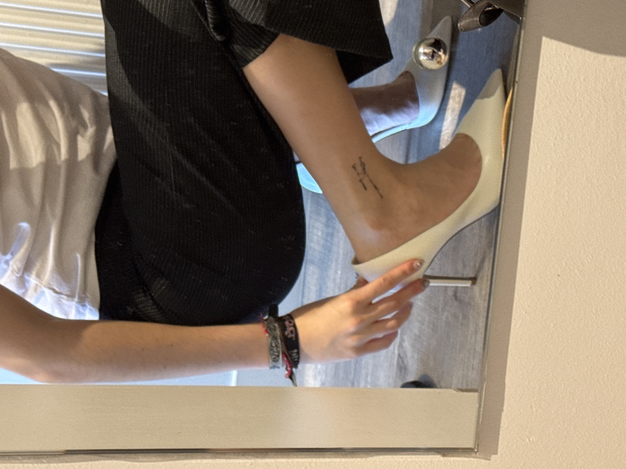 Person trying on shoes, taking selfies in Hull