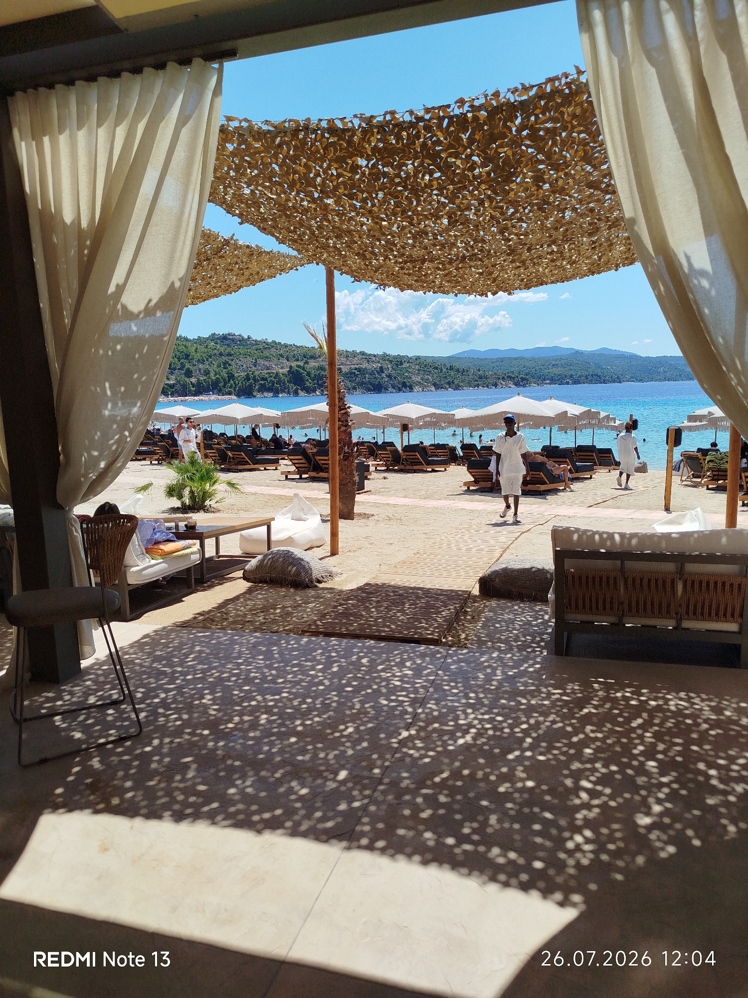 Beach resort morning in Sithonia, Greece — sun, sand, and café