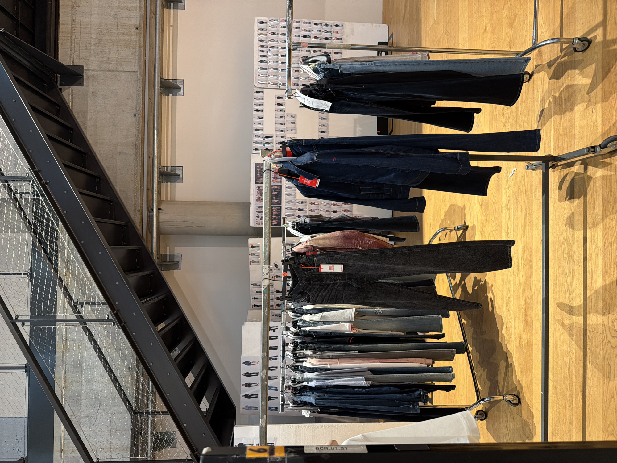 Retail store interior with metal staircase documented in Preara