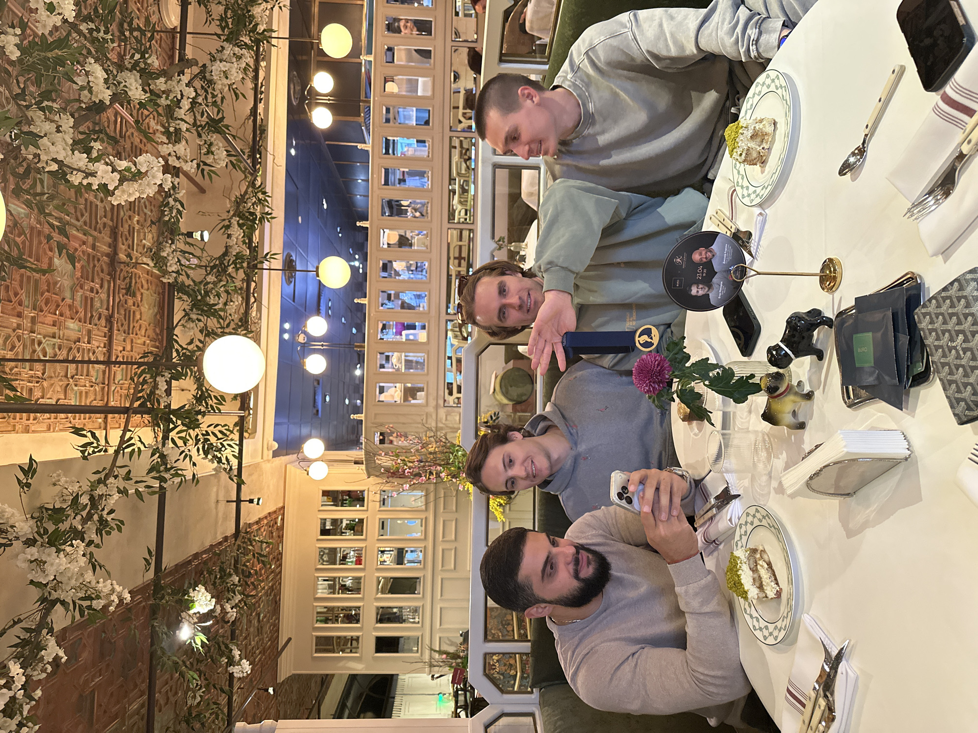 Four men celebrate with desserts at Moscow restaurant