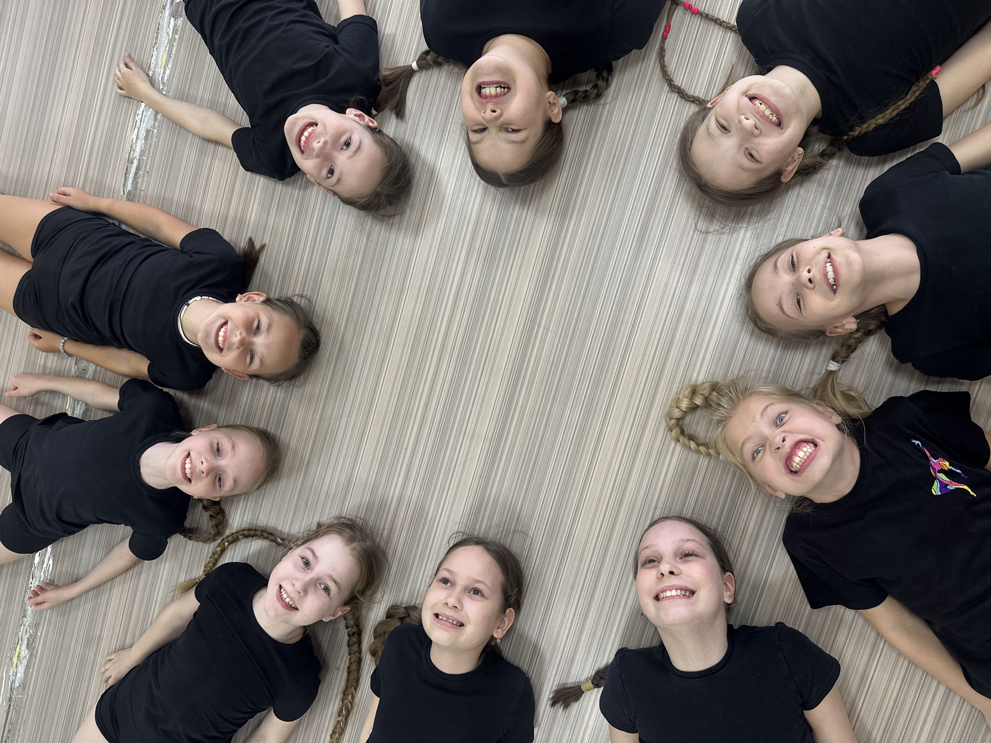 Dance students form creative poses during studio session in Votkinsk