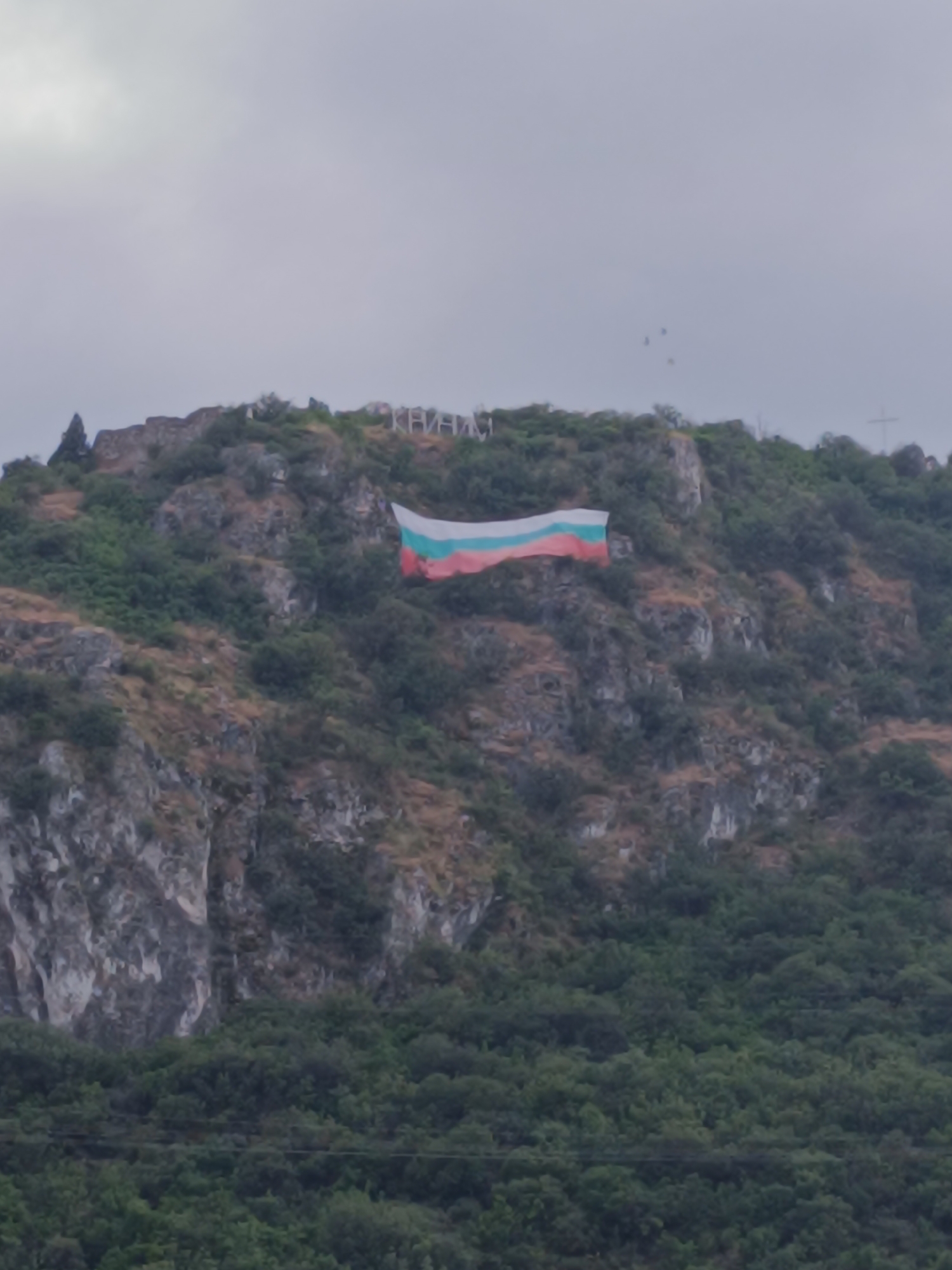 Bulgarian flag on a hillside, glitter nails on a tabletop