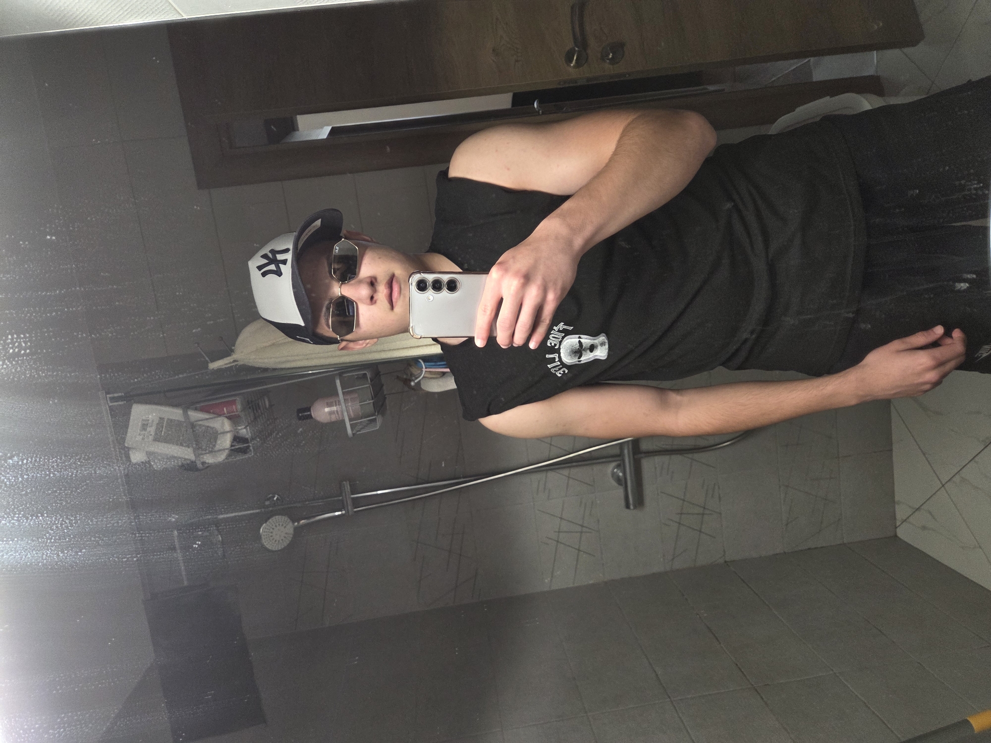 Person takes bathroom selfie in Sofia wearing casual attire