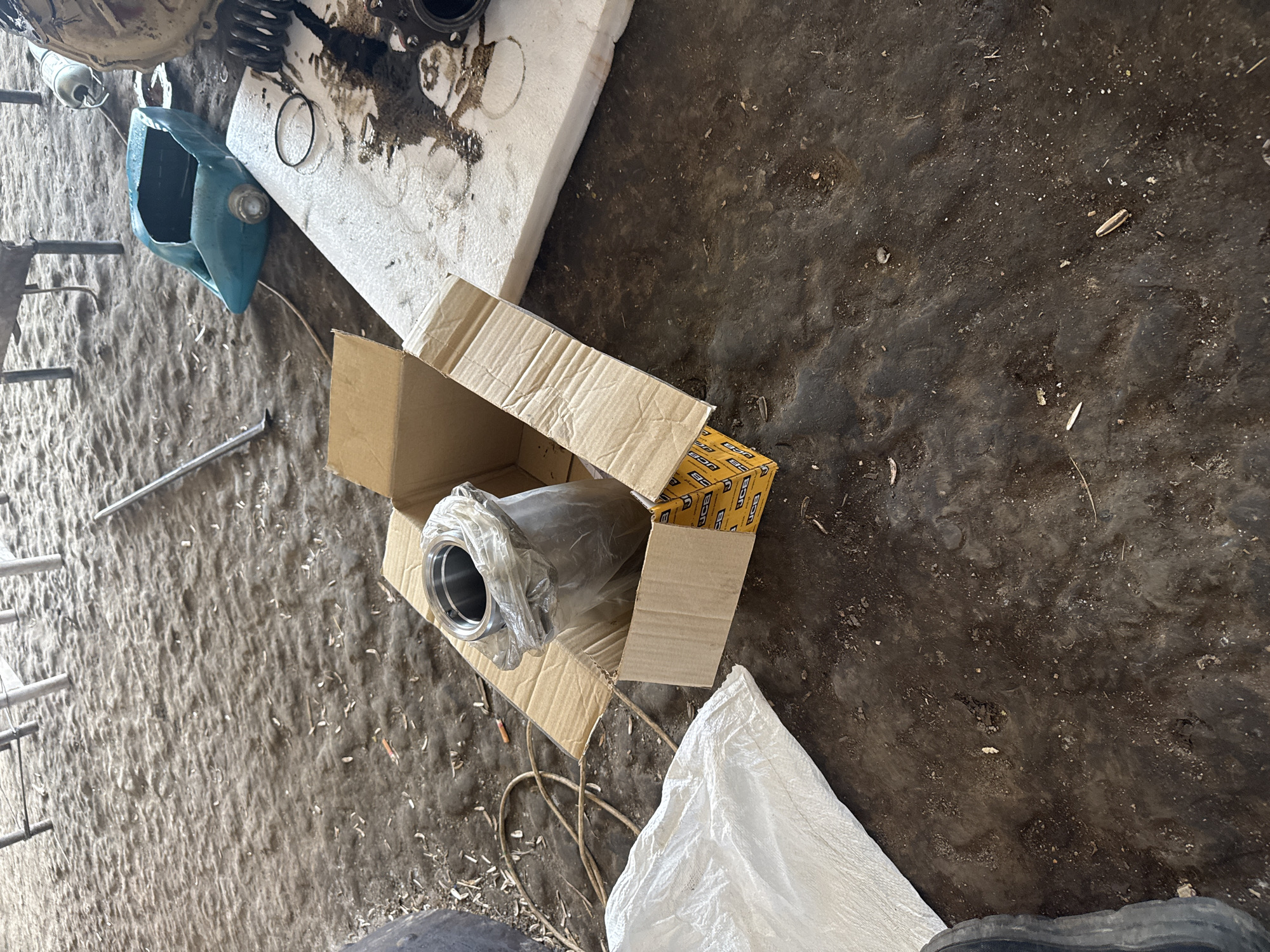 Men work on mechanical repairs in Sarnevo workshop