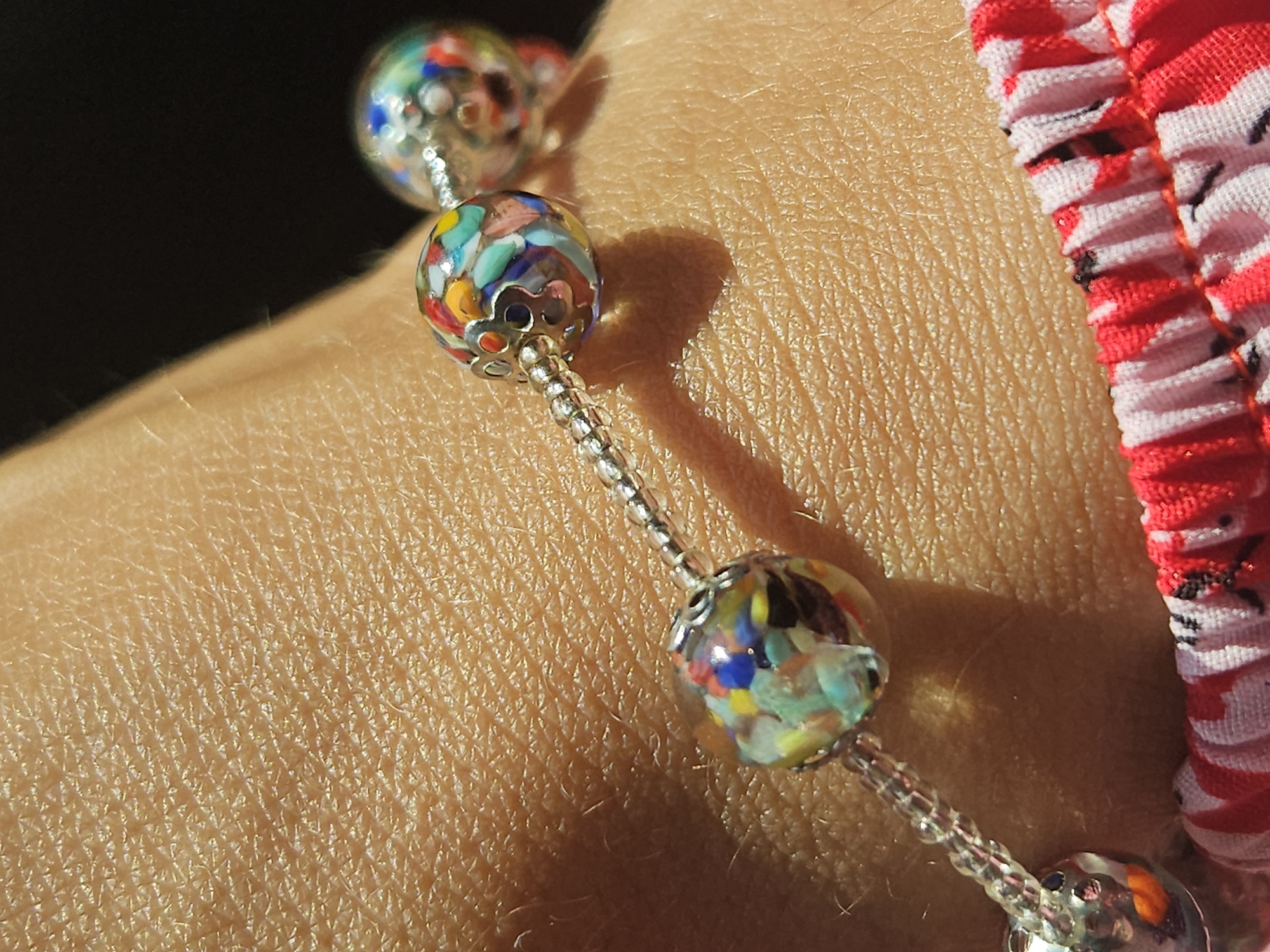 Berry-topped pastries and a beaded bracelet in Podgorica
