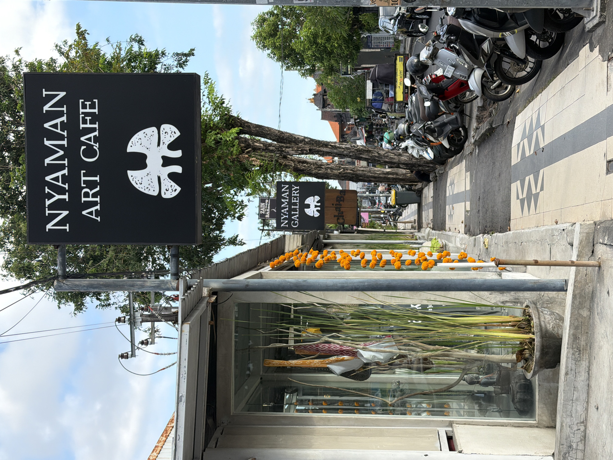 Morning walk through Kuta's commercial district captures local businesses