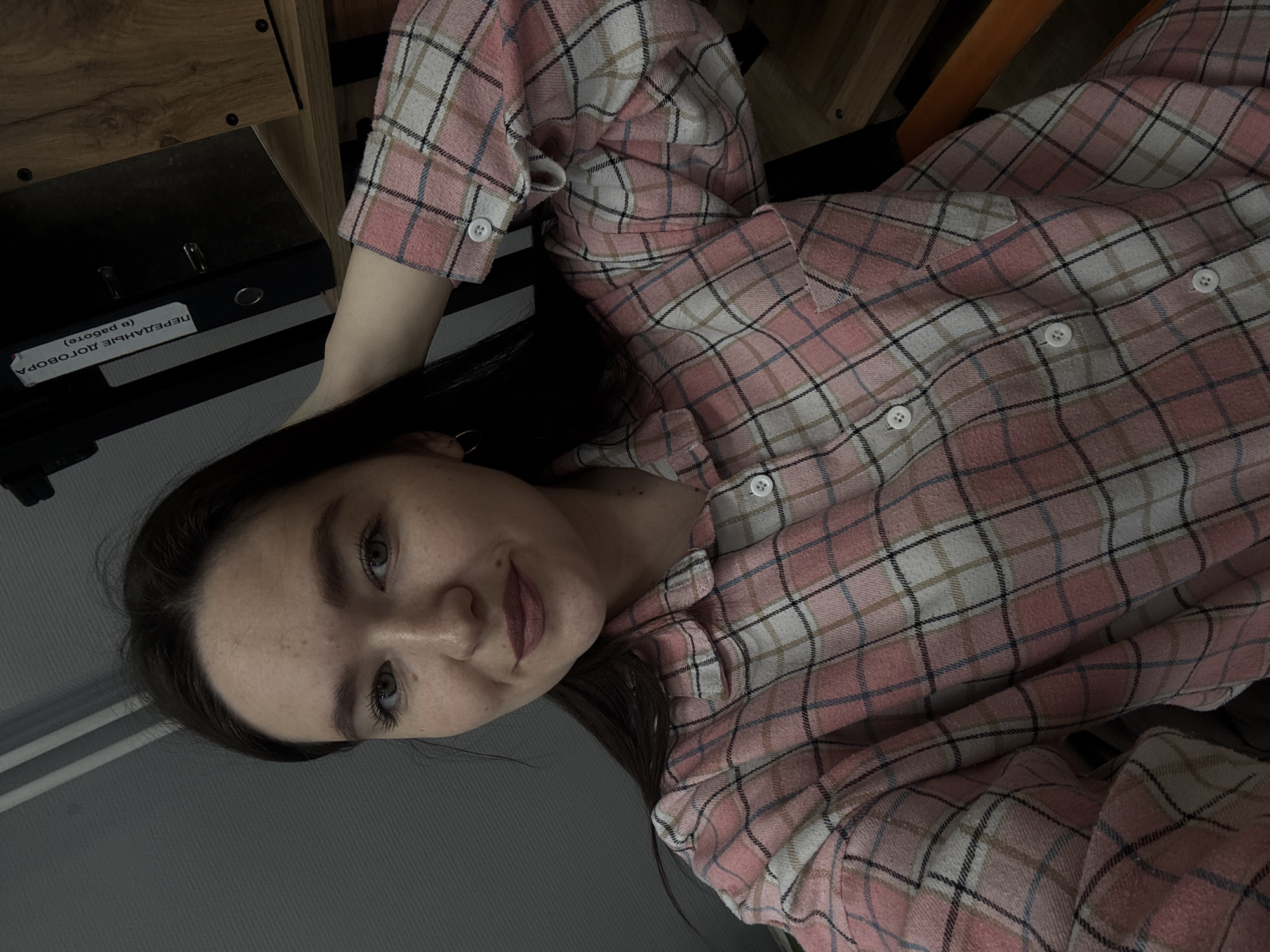 Woman photographed in office setting in Chaikovsky, Russia