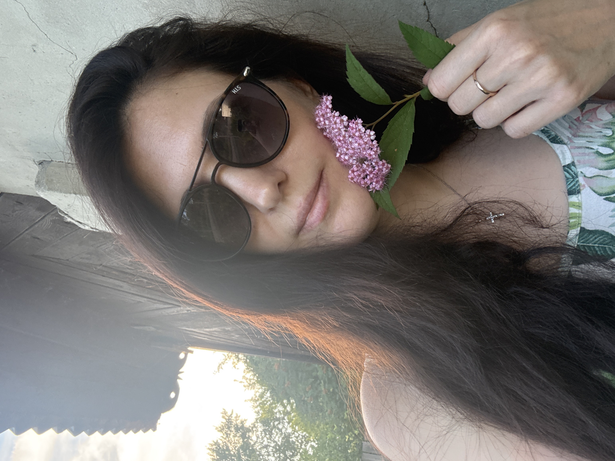 Posing with wildflowers and ferns in a Kurgan green space