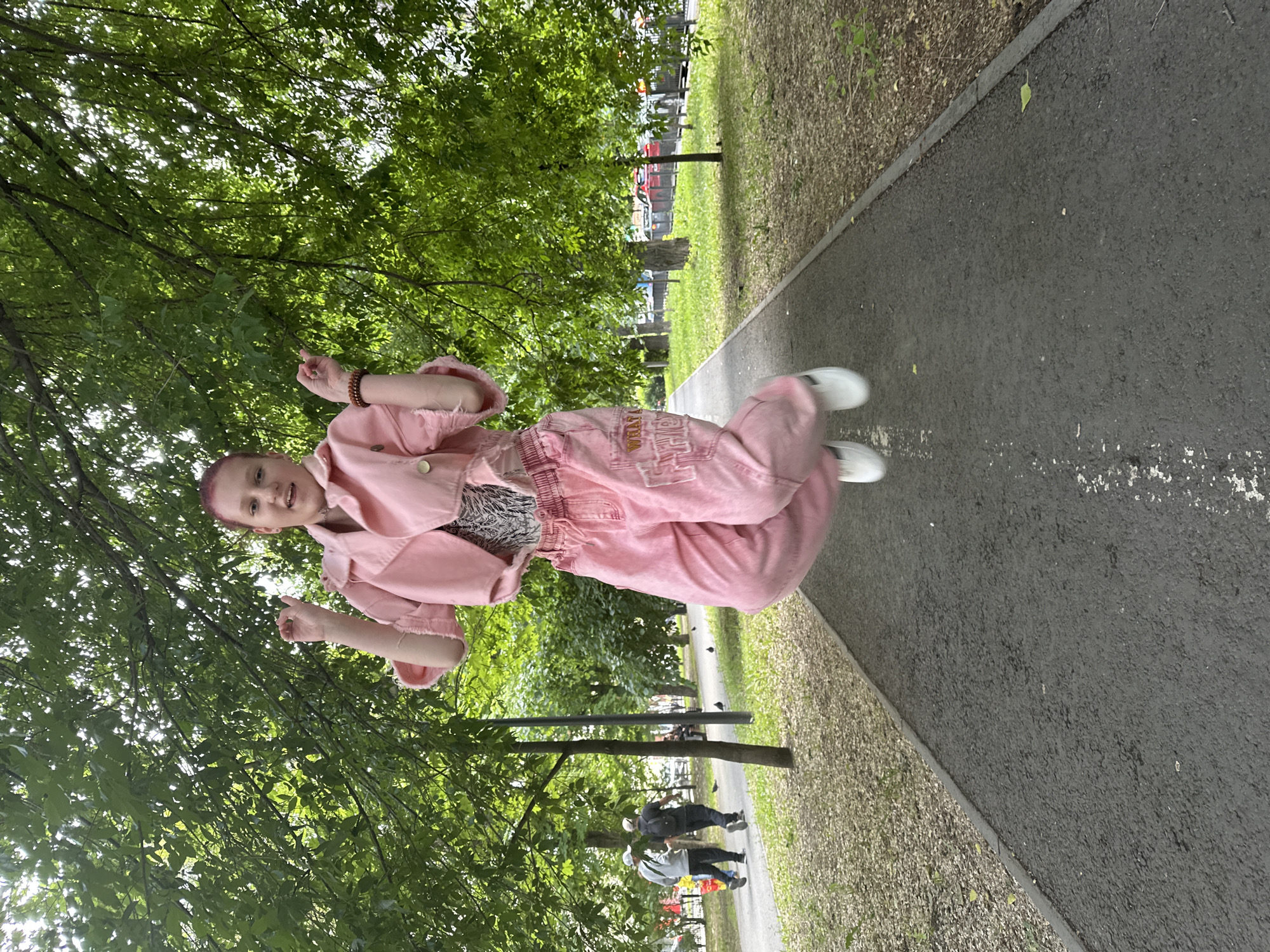 Person in pink outfit spotted on park pathway in Saratov