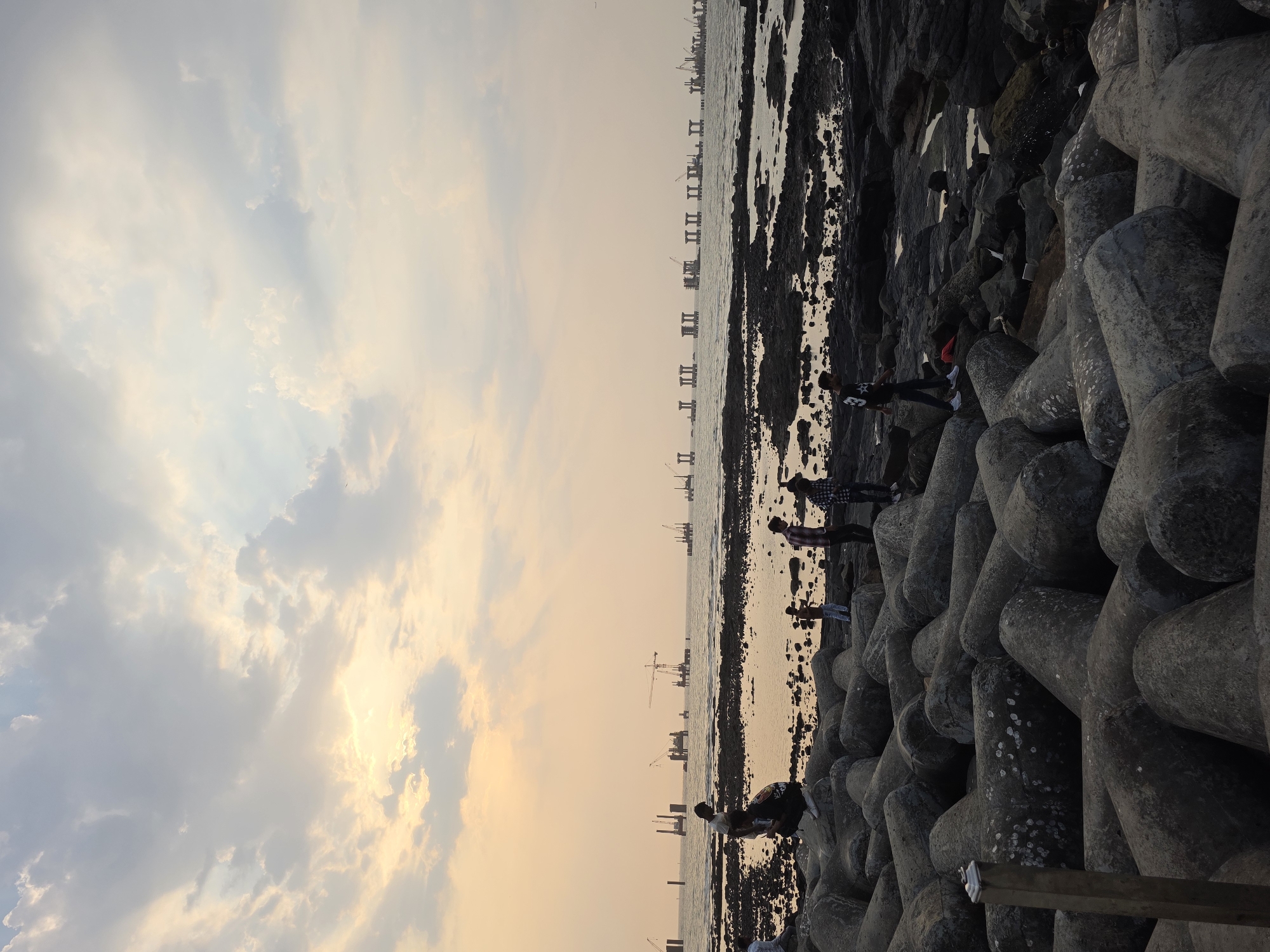 Mumbai coastline documented during midday golden hour sunset