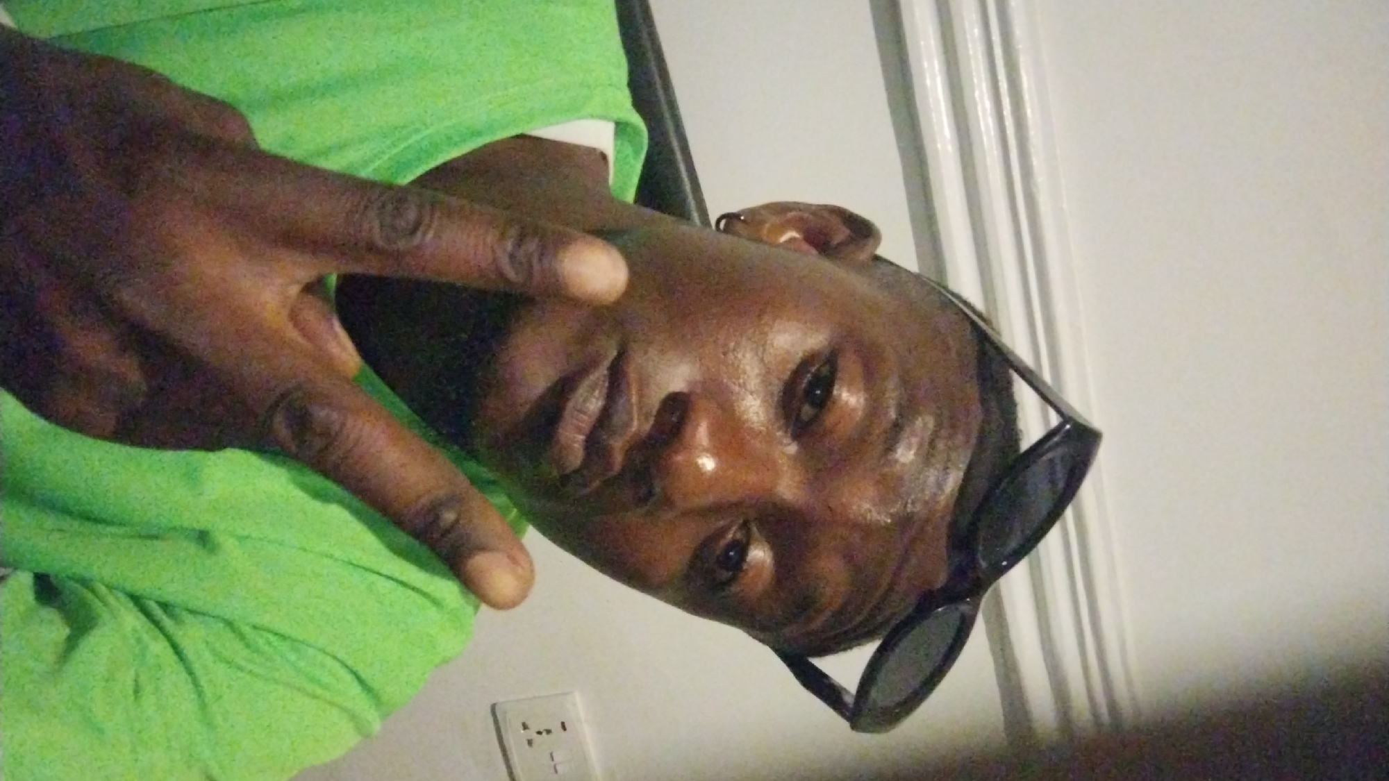 Person documented smoking, posing indoors in Jos Nigeria