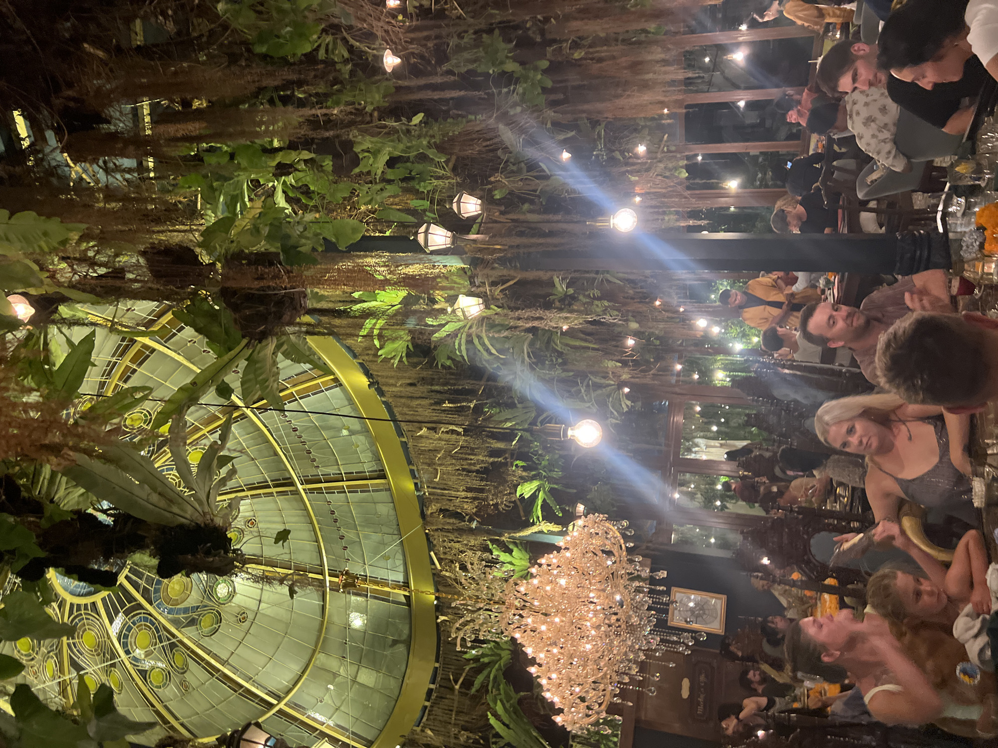 Restaurant interior with ornate glass dome ceiling documented in Ubud