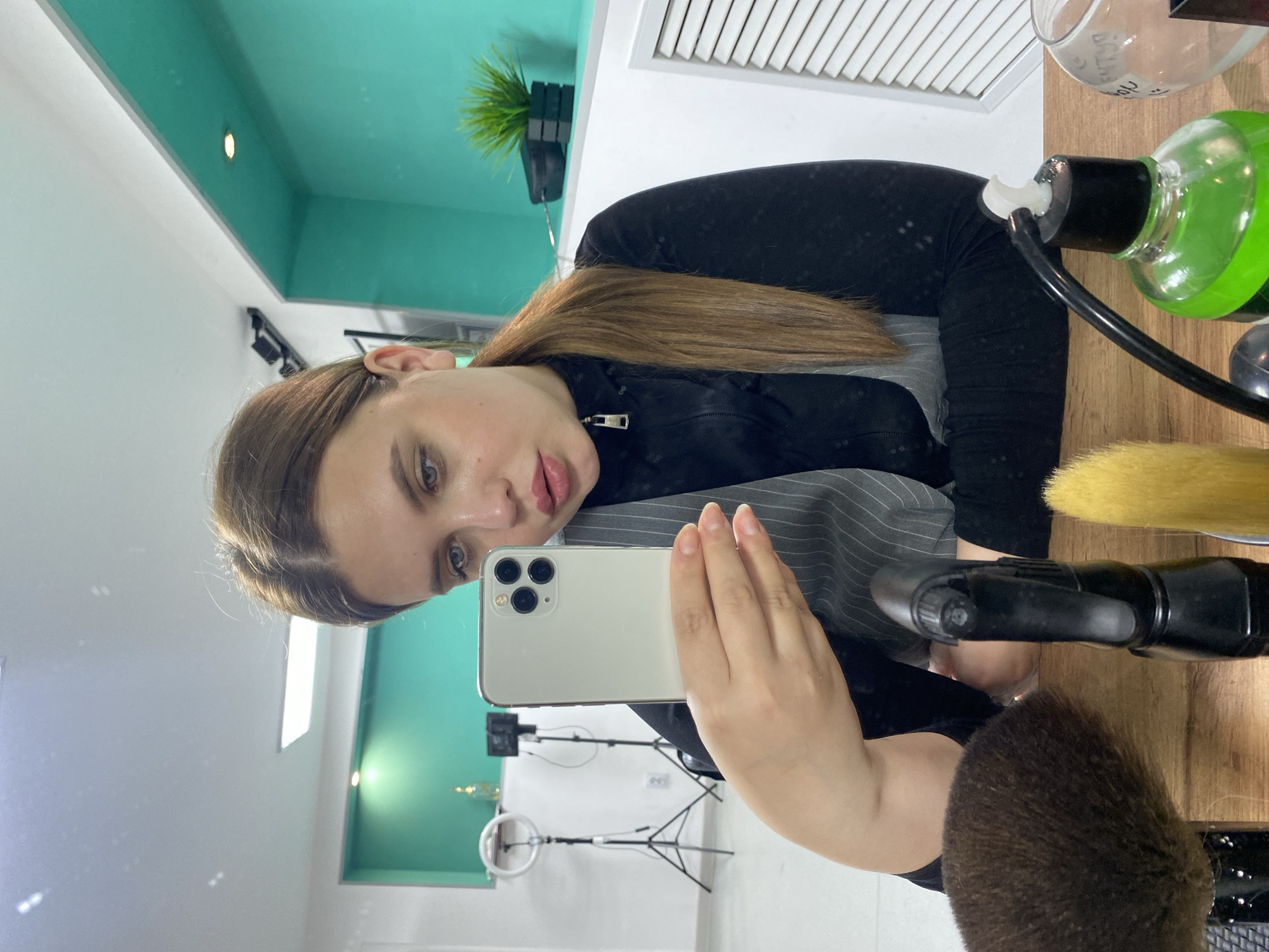 Woman takes selfie at modern hair salon in Chernushka