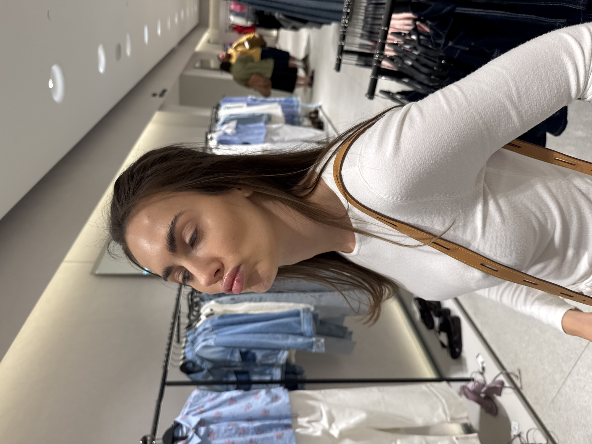 Woman shops for clothes, works at desk during afternoon