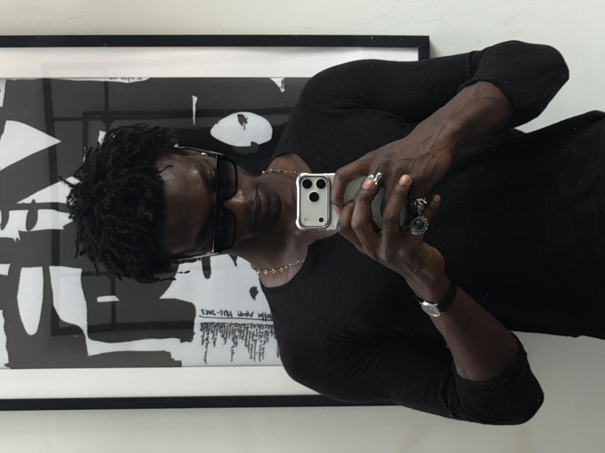 Mirror and artwork selfies from a London interior