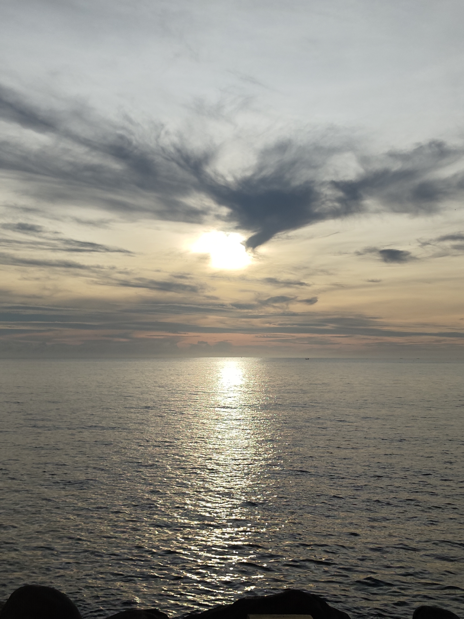 Sunset seascape with boats observed in Lhokseumawe, Indonesia