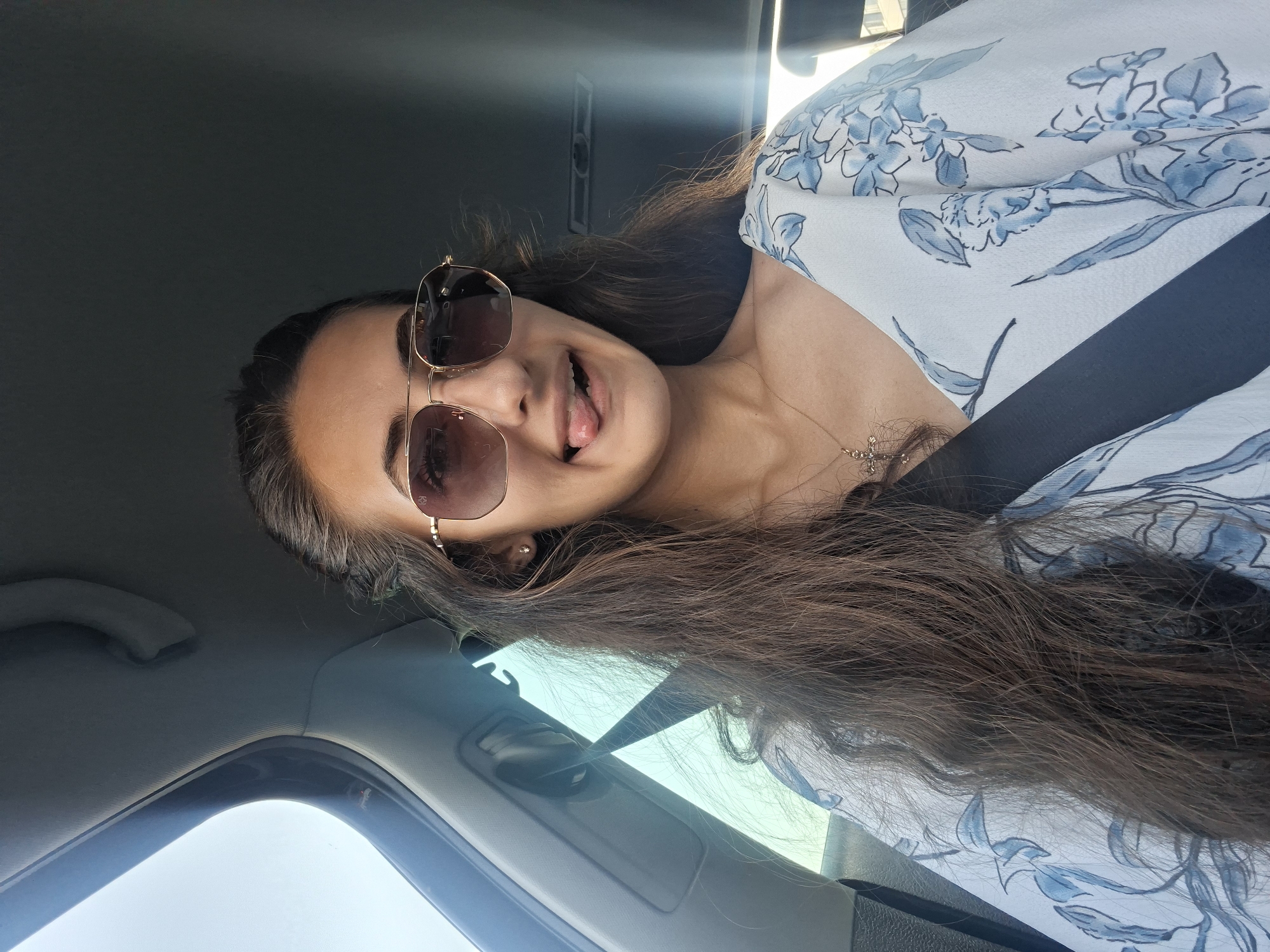 Car ride vibes with a teddy bear and red nails