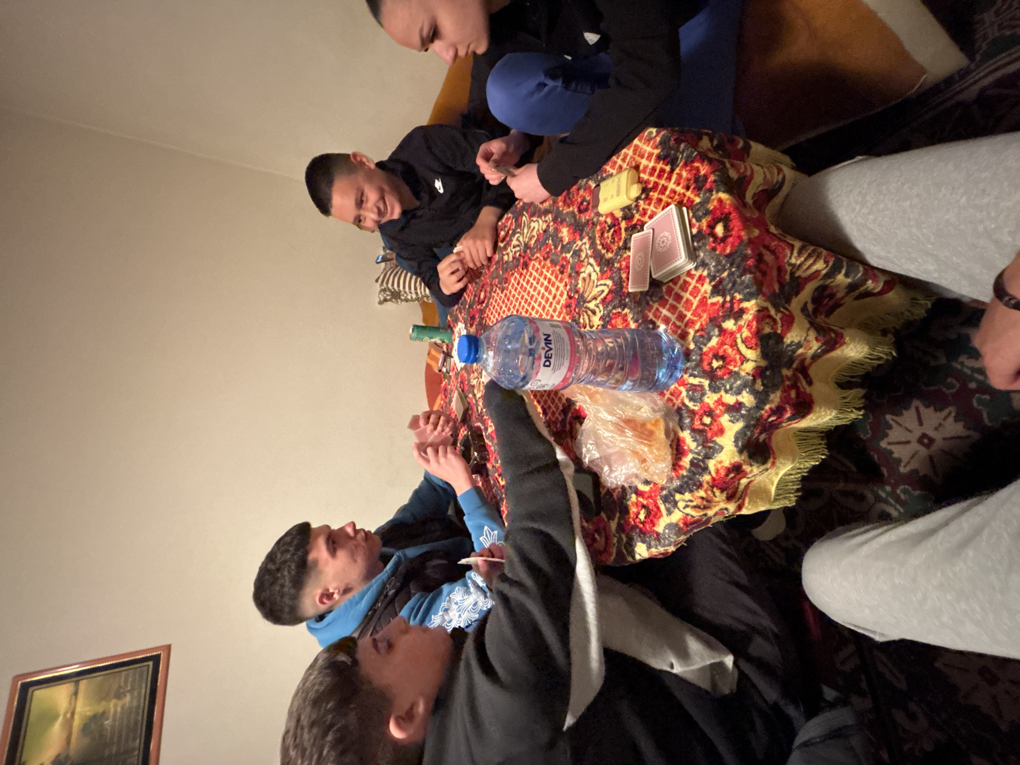 Young men play cards in Goritsa, Bulgaria