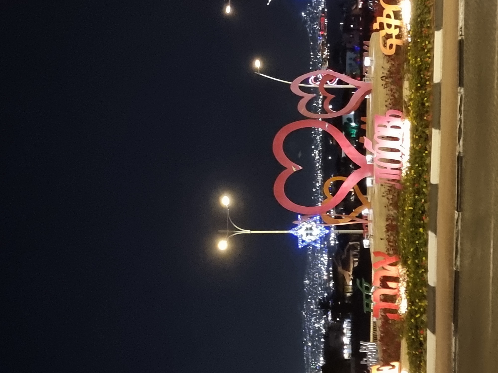 Nighttime scenes captured in Eilat: illuminated decorations, swimming pool