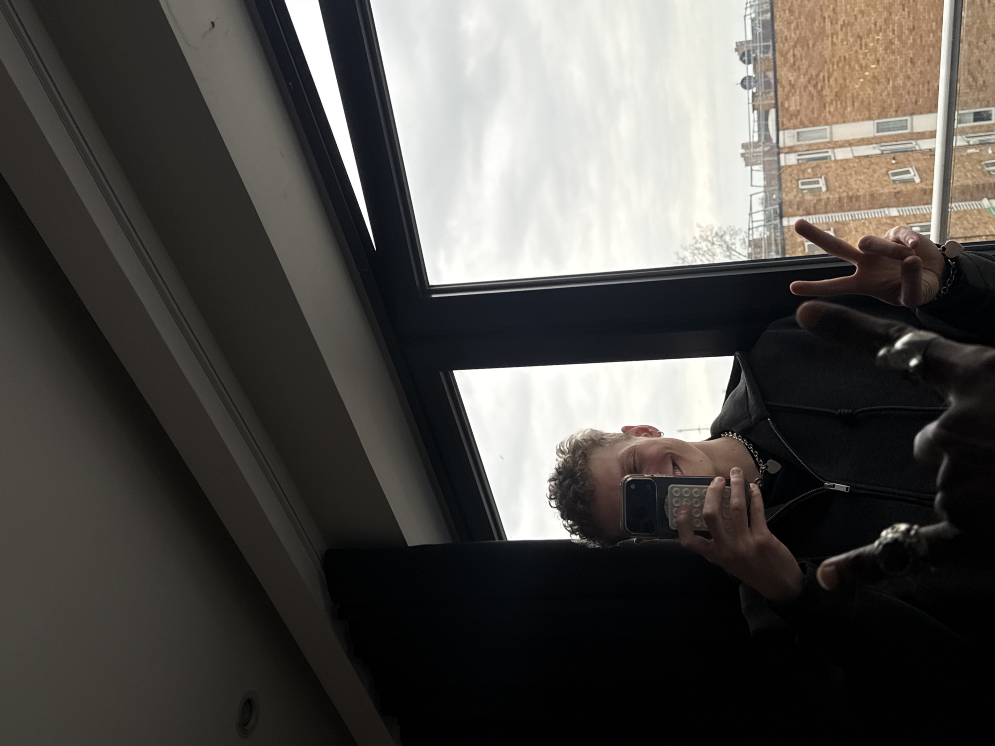 Person takes selfie, another spotted on metal flooring in London