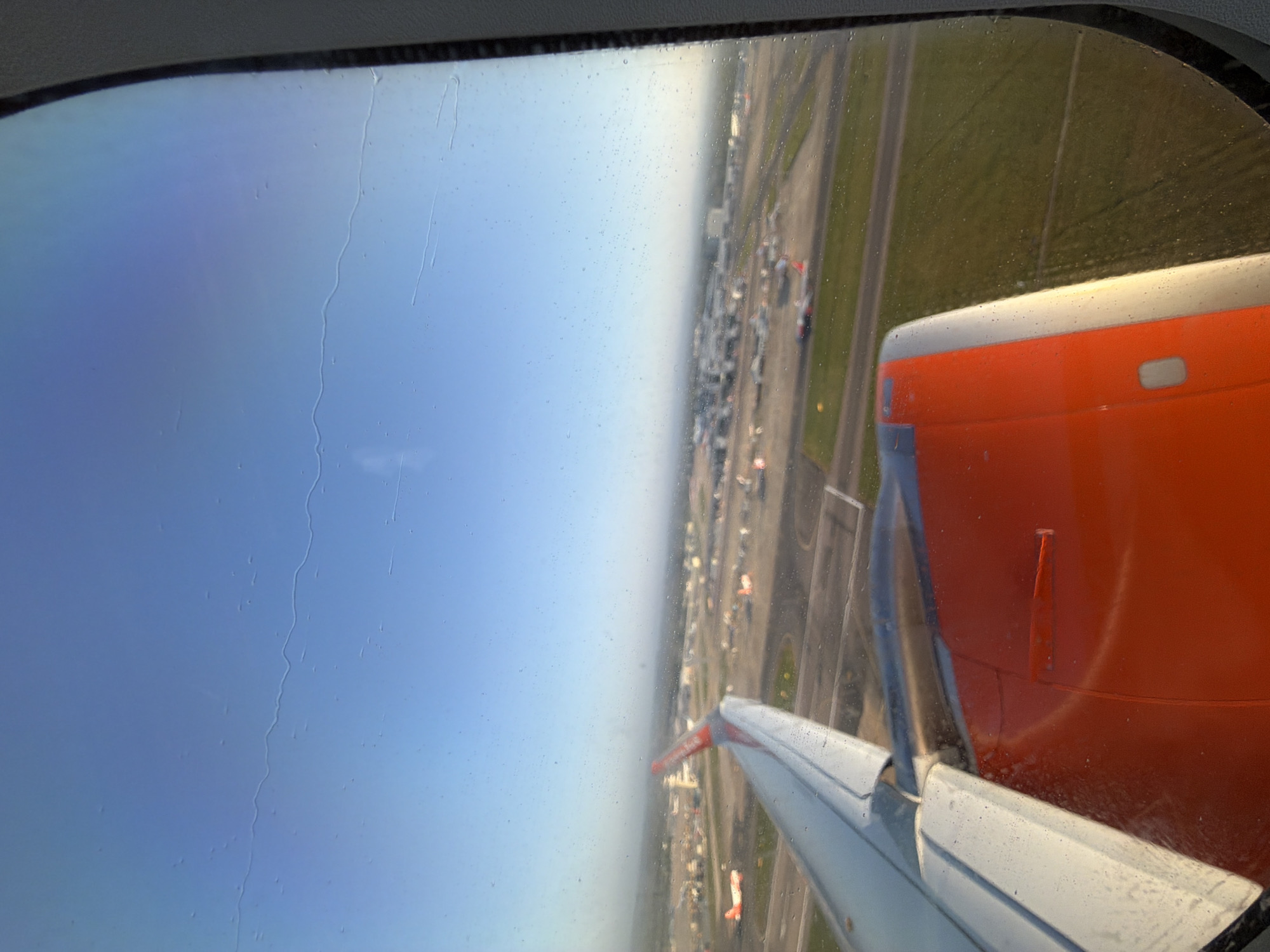 Passenger captures aerial view of UK airport during morning flight
