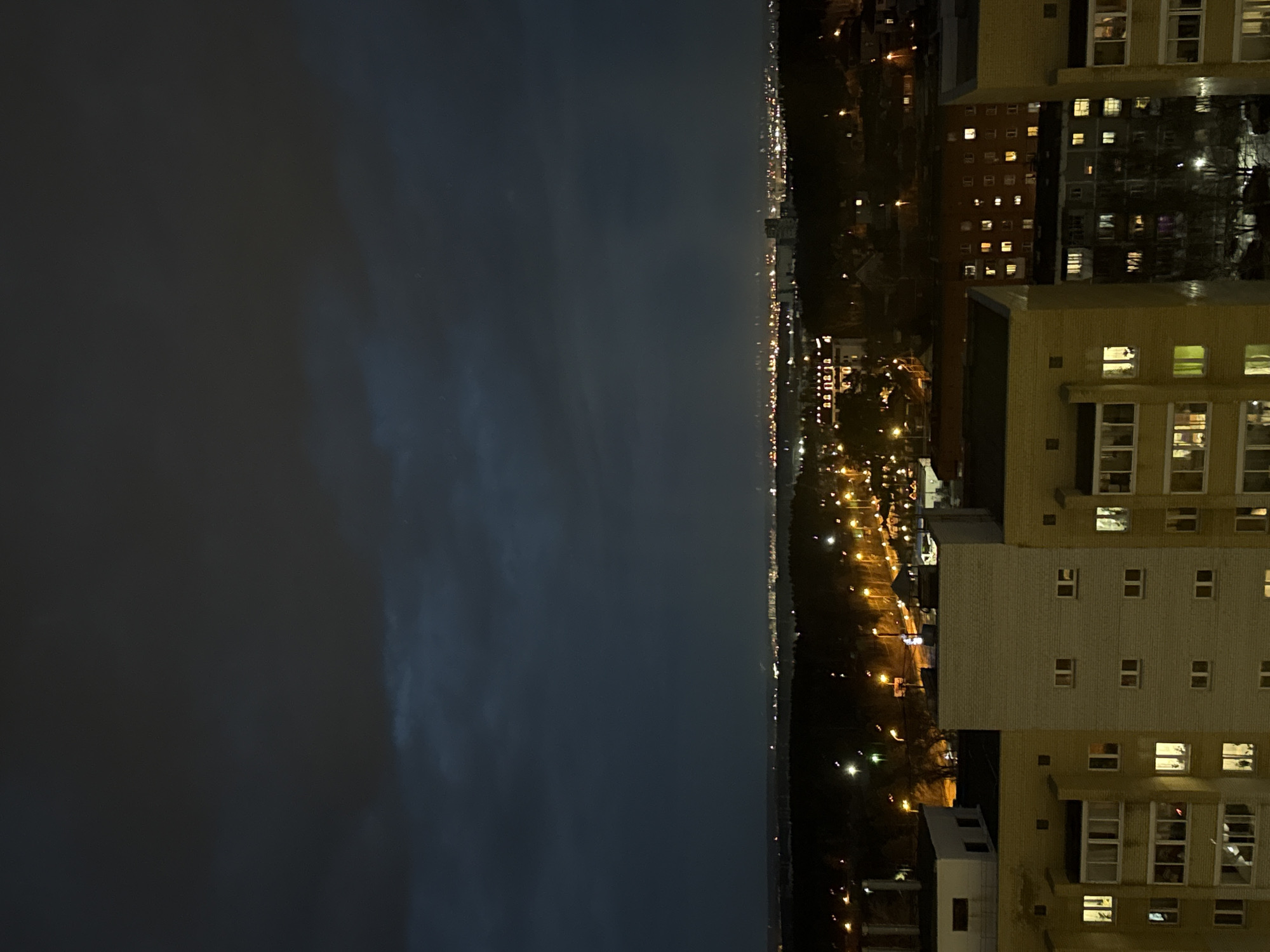 Night view of illuminated apartment building captured in Yekaterinburg