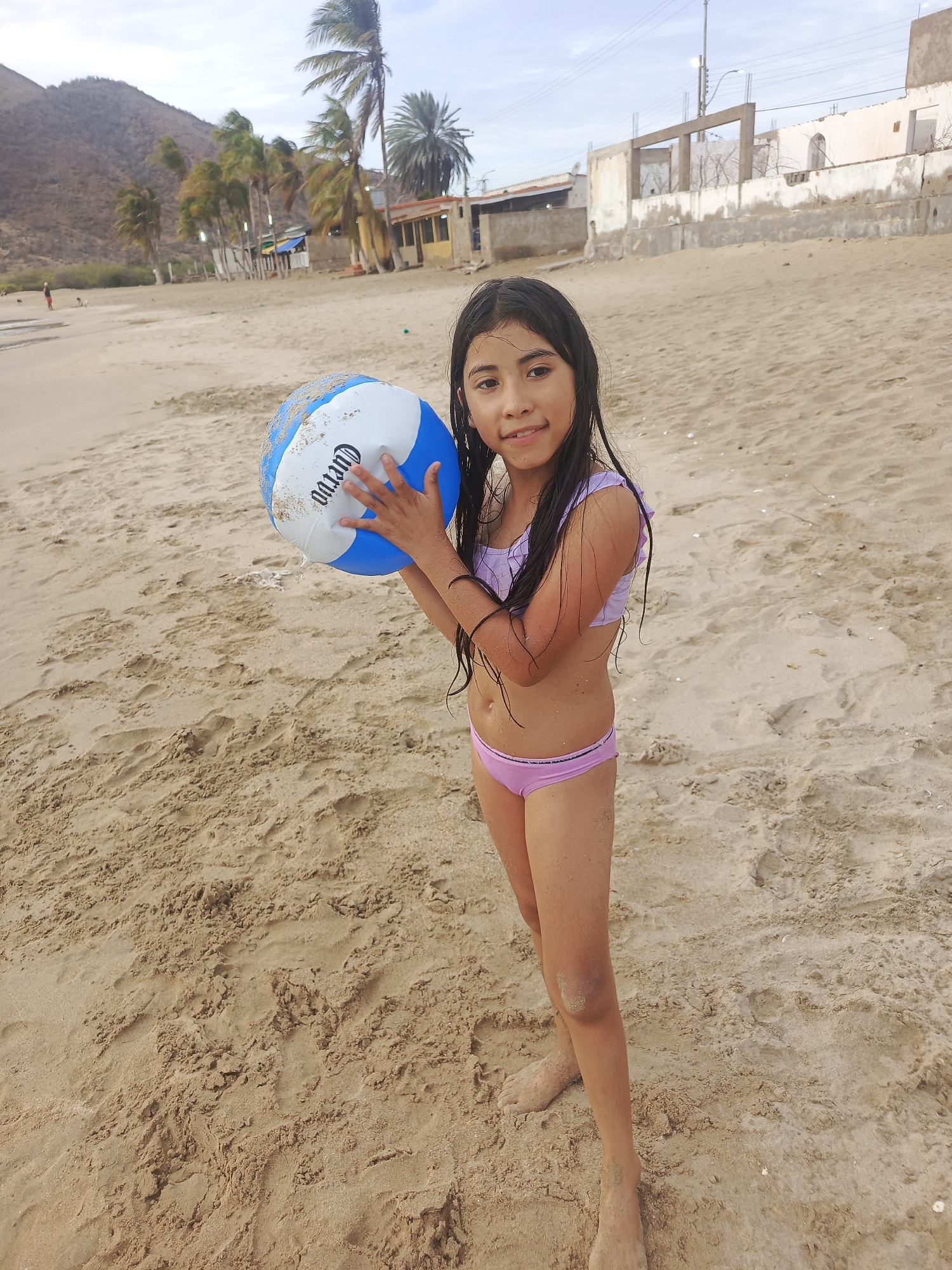 Beach evening at Juan Griego with swimming, ball play, and sunset