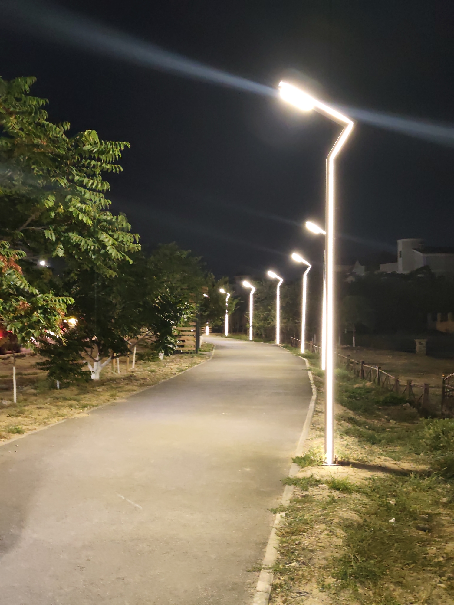 Night walk along a lit promenade in Aktau, Kazakhstan
