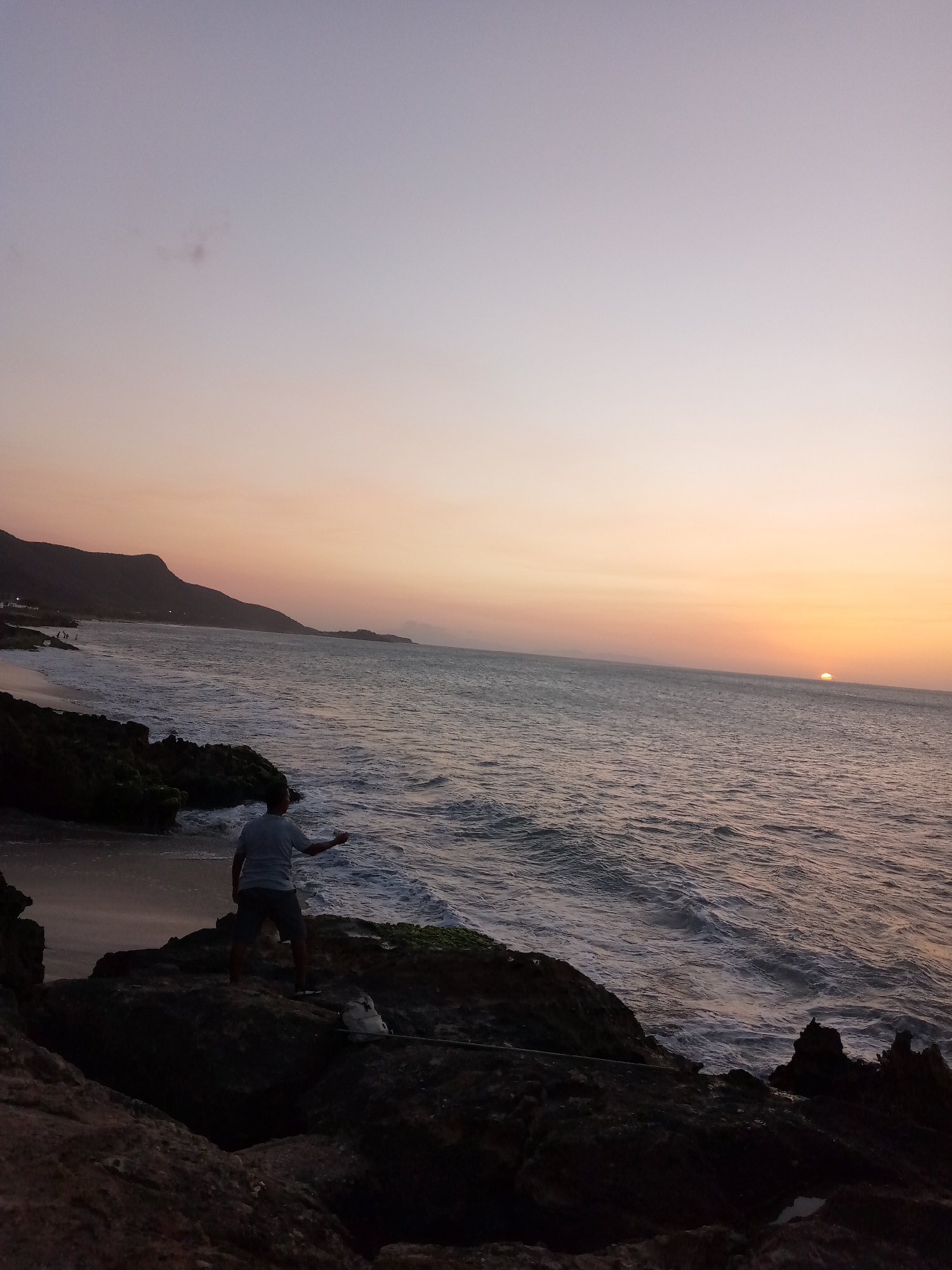 Sunset photography session at Juan Griego stone oceanfront structure