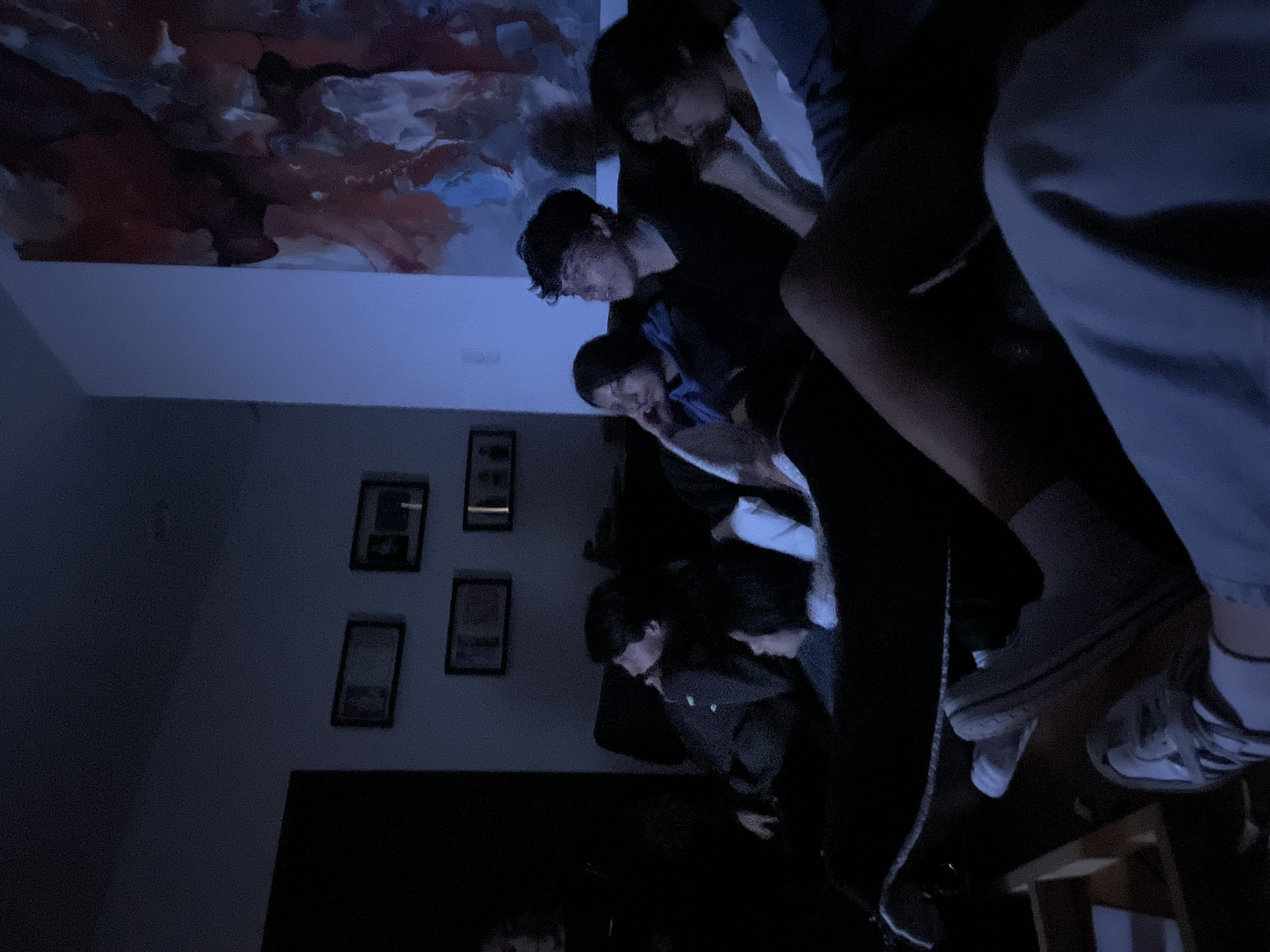 Young people gather for late night screen viewing session