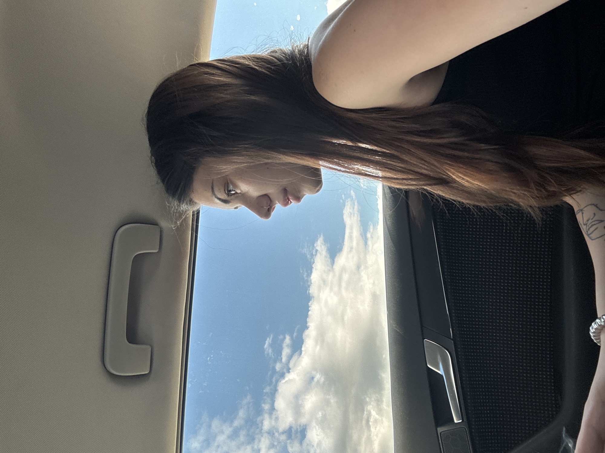 Woman photographed gazing from car window in Bulgaria