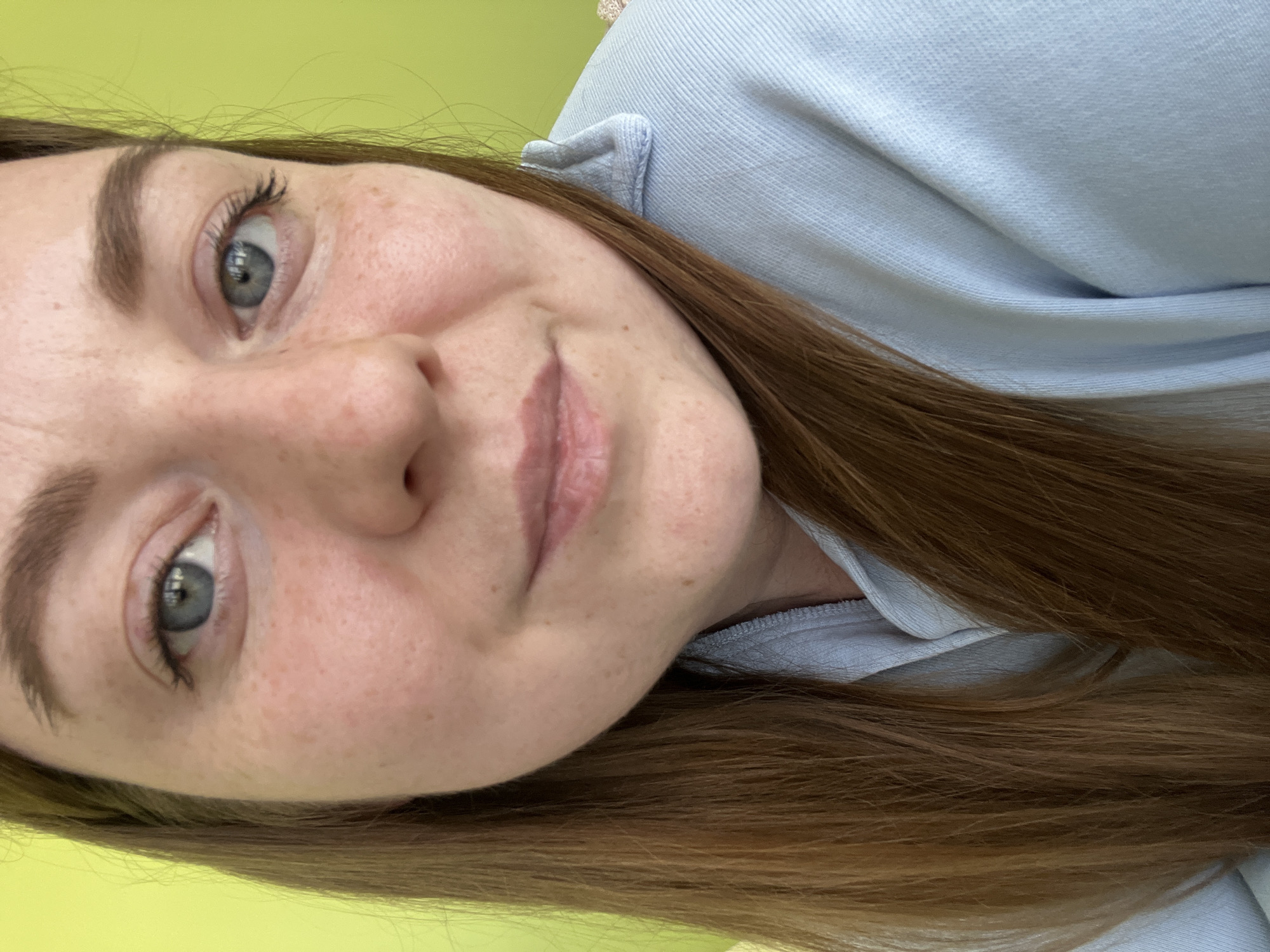 Woman documents workday with selfies at Klin office