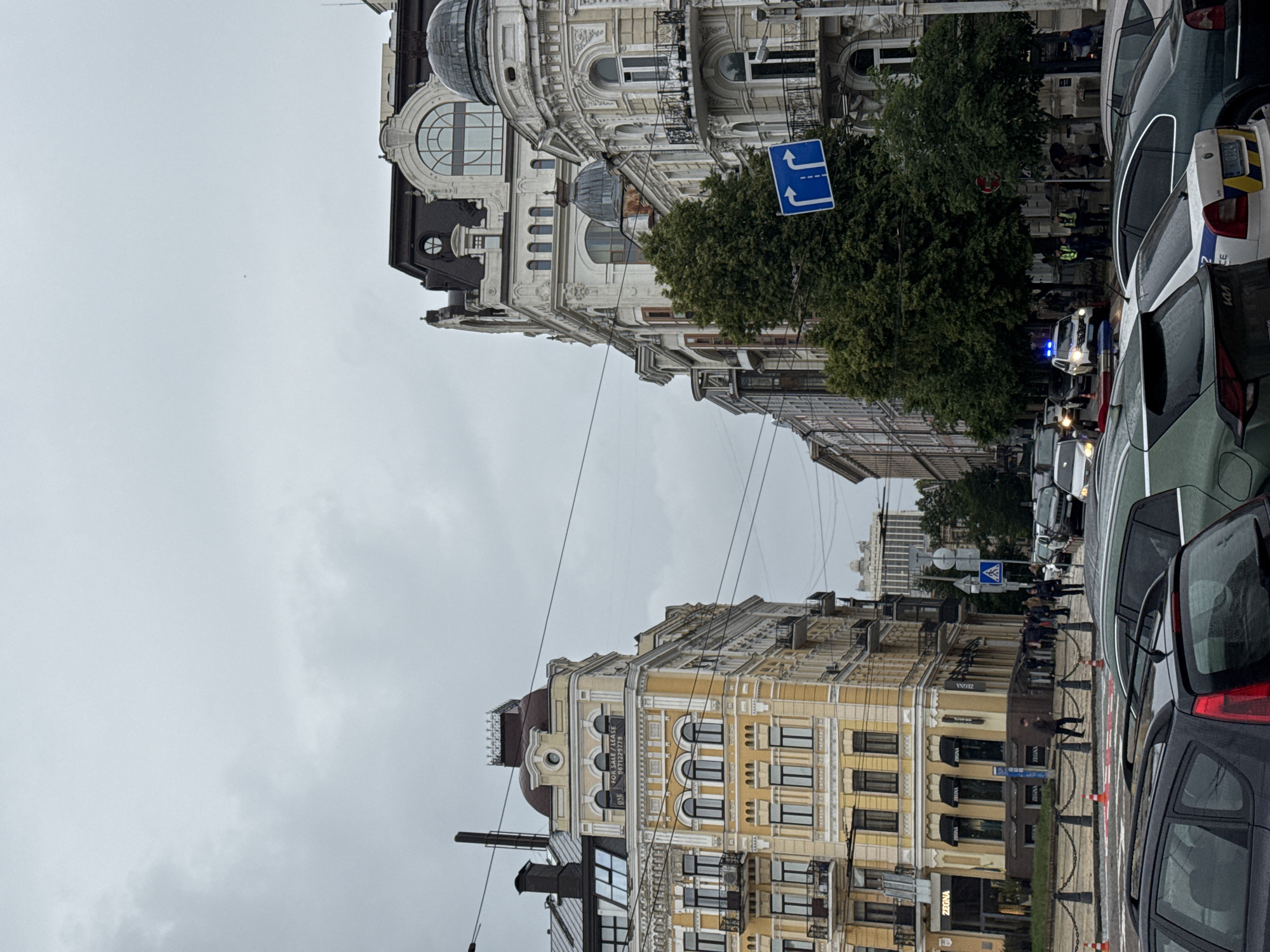 Overcast afternoon scenes captured across central Kyiv streets