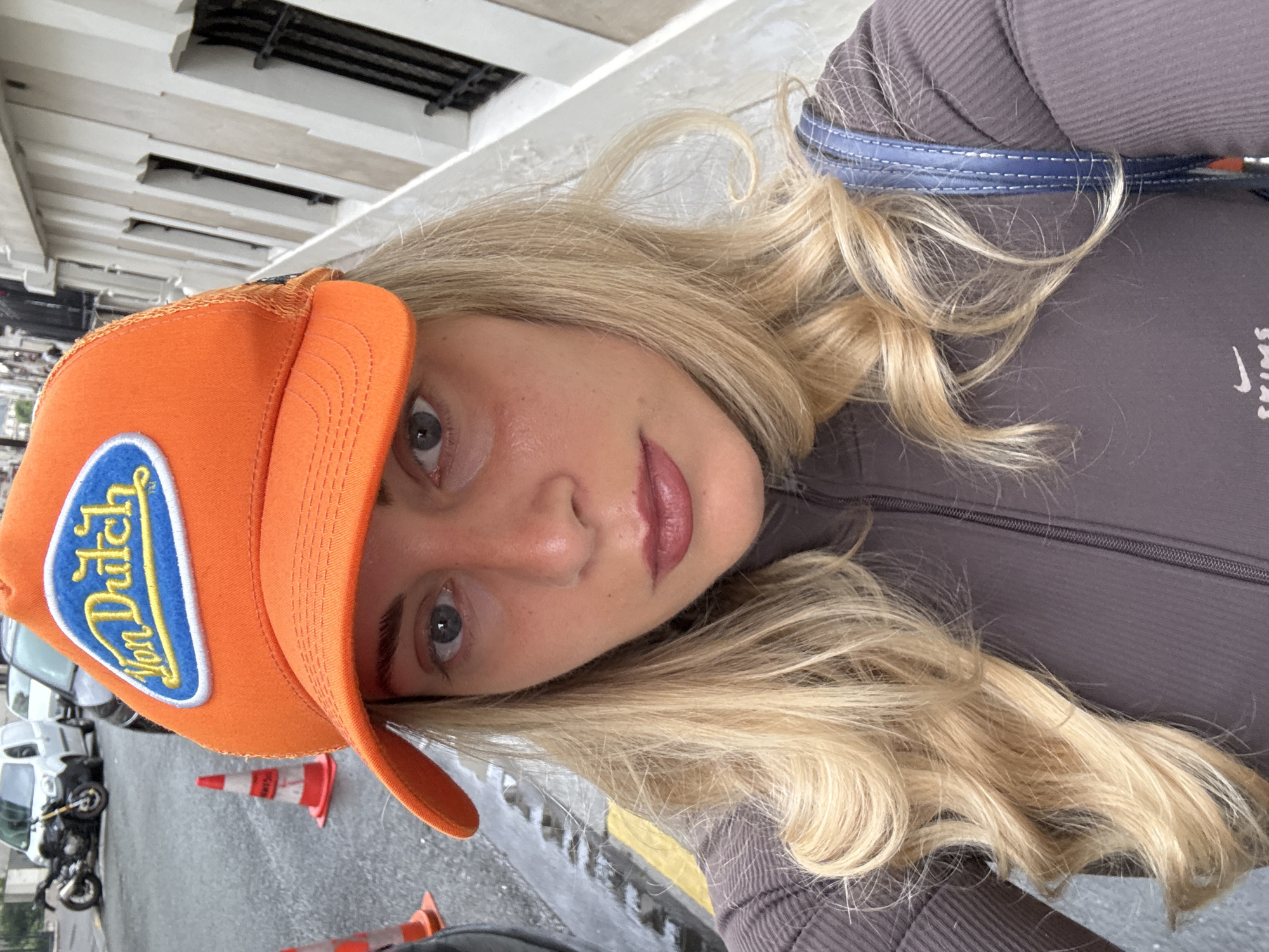 Woman in Orange Von Dutch Cap Photographed in Paris